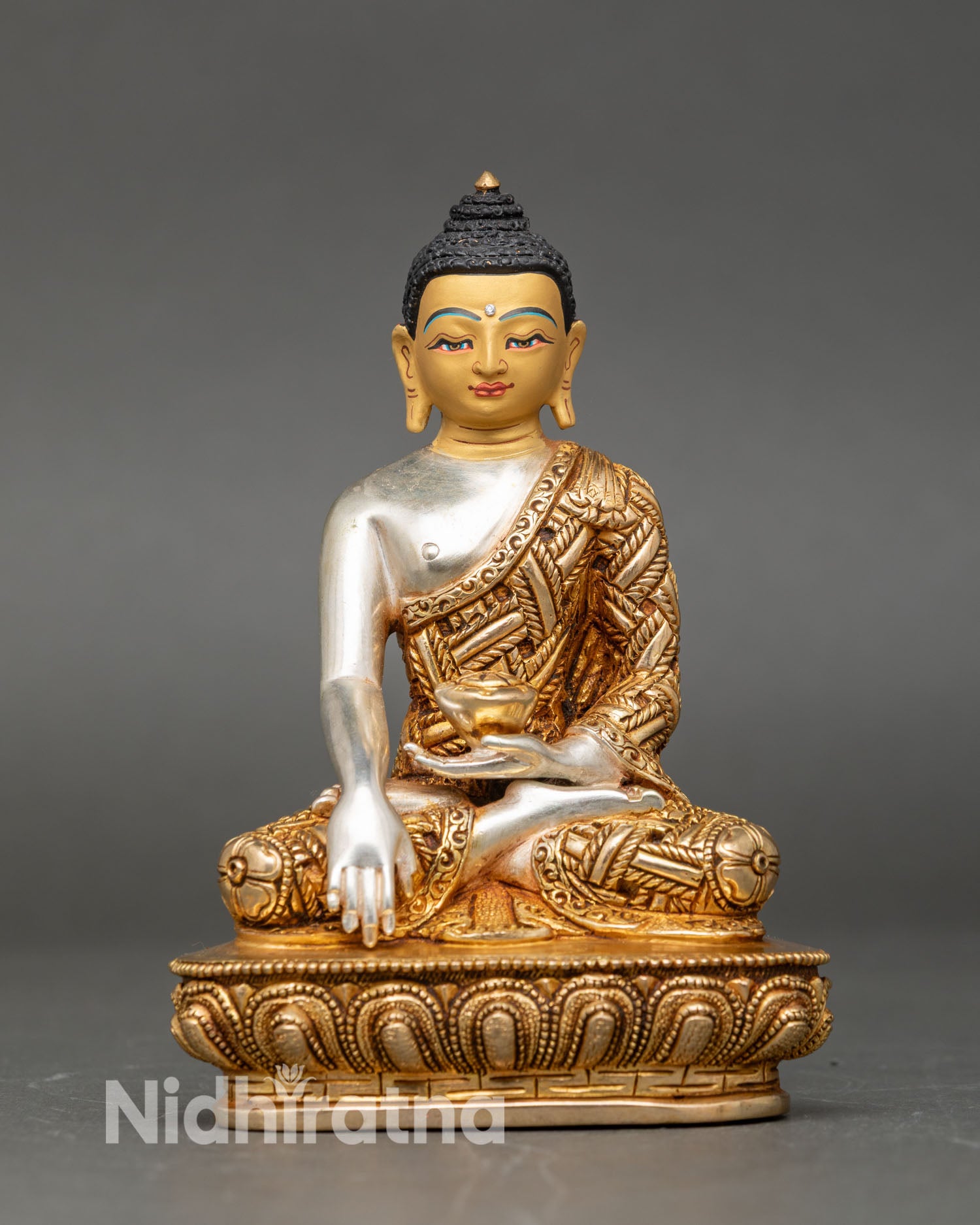 Shakyamuni Buddha close up earth touching mudra patra bowl gold painted face