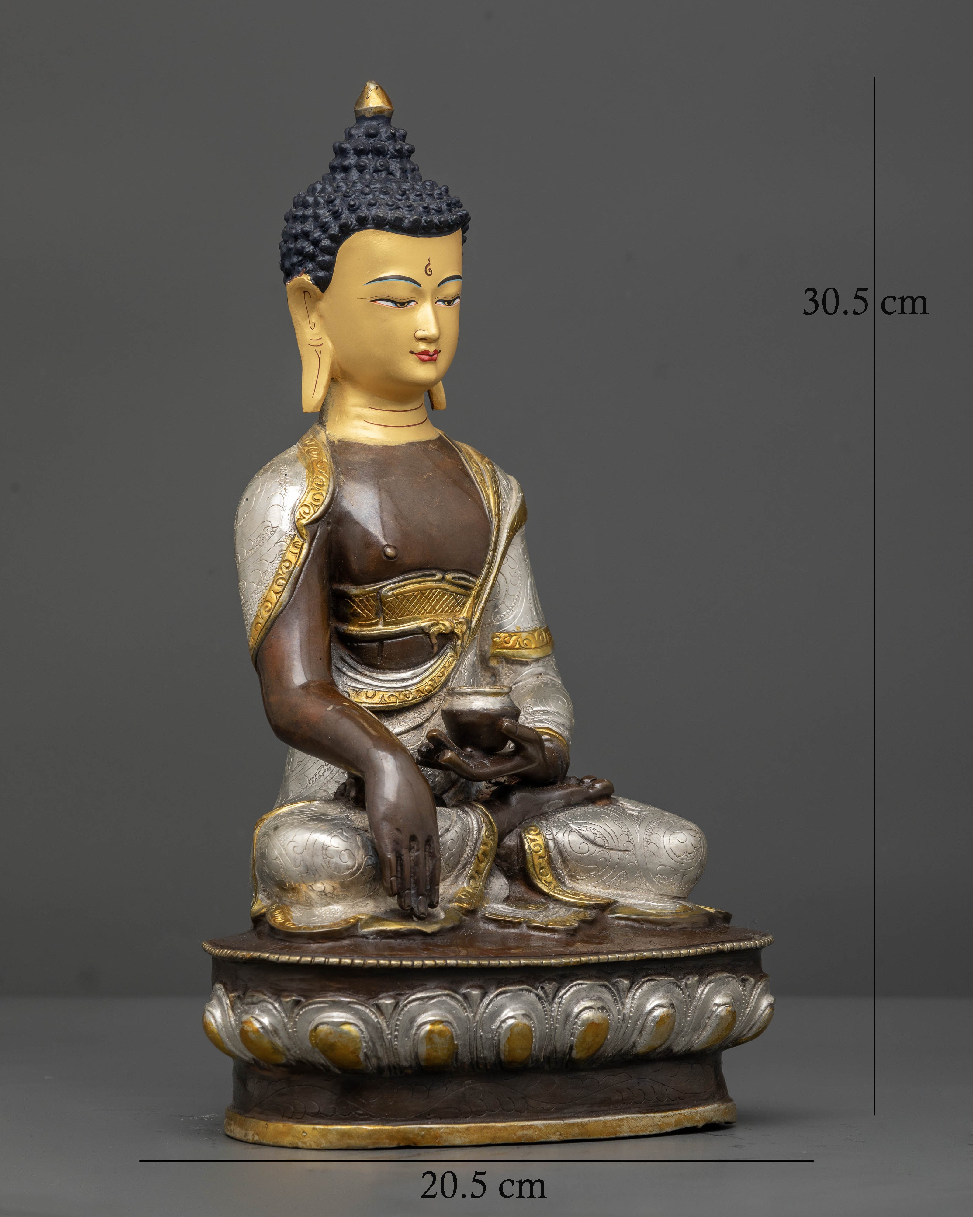 Shakyamuni Buddha seated on a lotus pedestal in earth touching mudra with alms bowl