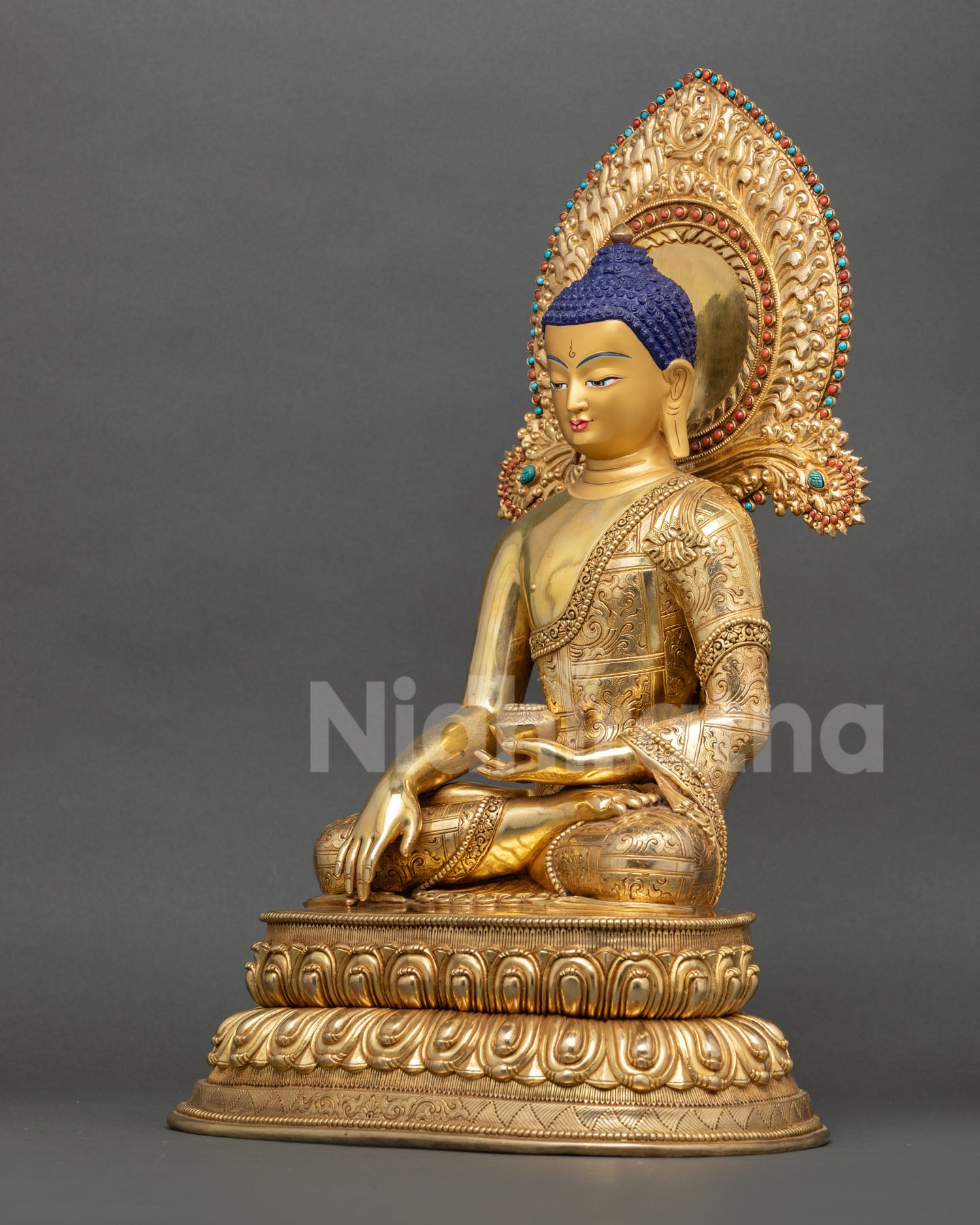 Shakyamuni Buddha gold painted face with ornate turquoise and coral stones