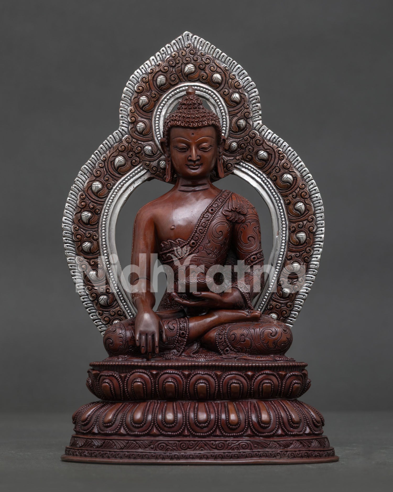 Shakyamuni Buddha oxidized copper statue with silver plated halo front view.
