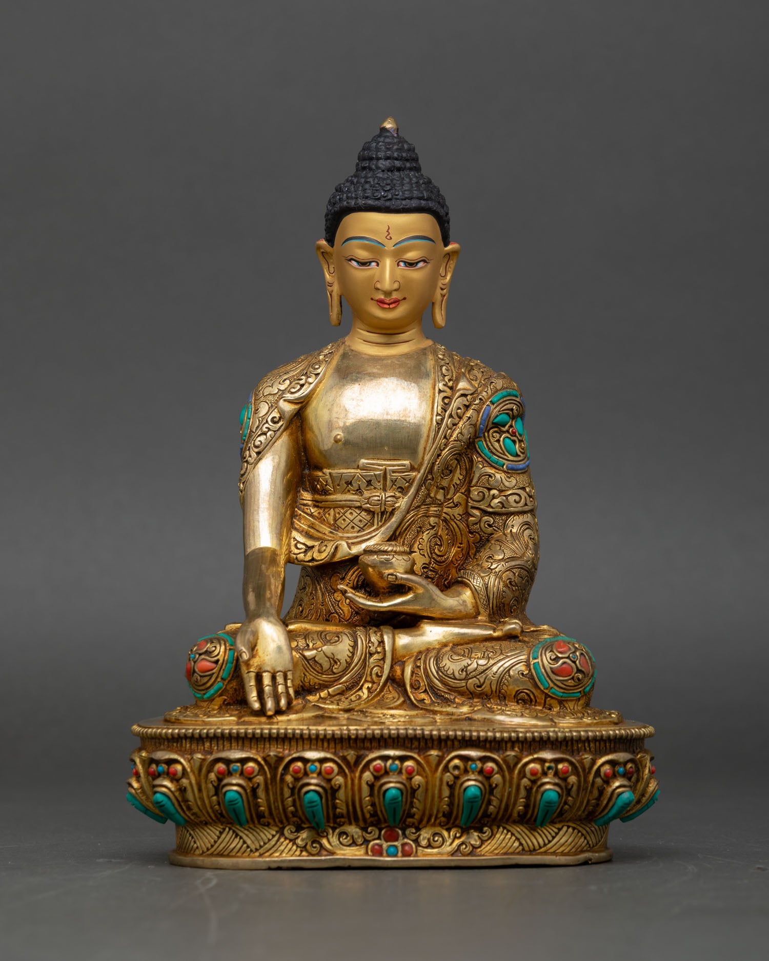 Shakyamuni Buddha seated meditation pose, earth touching gesture copper gold painted face lotus pedestal nepal
