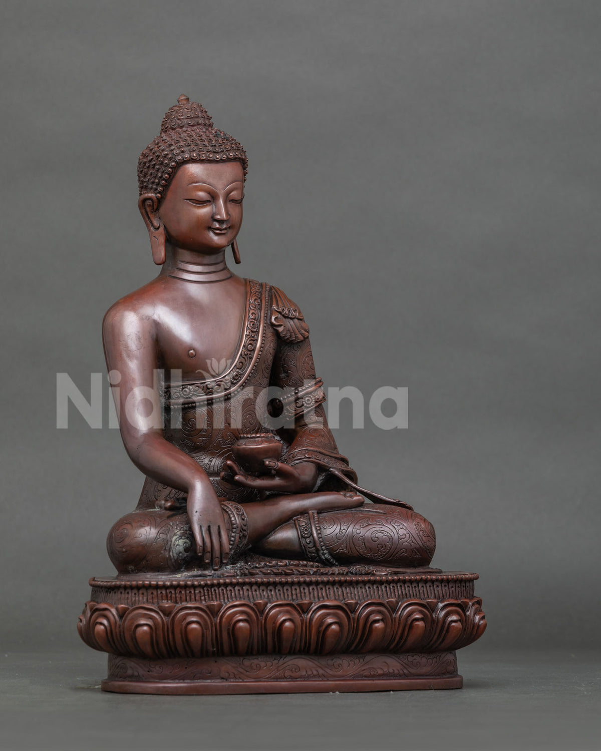 Shakyamuni buddha seated on handcarved lotus pedestal holding begging bowl.