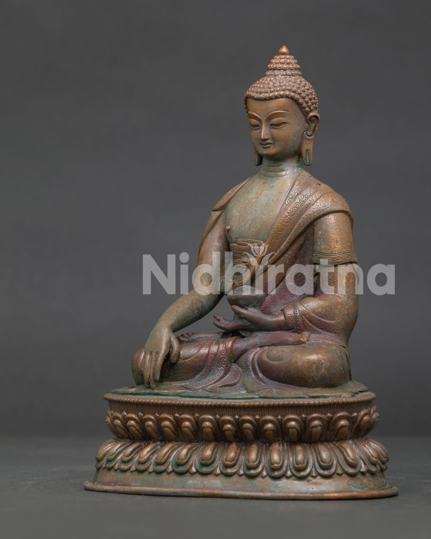 Shakyamuni Buddha showing Bhumisparsha Mudra and monk’s begging bowl.