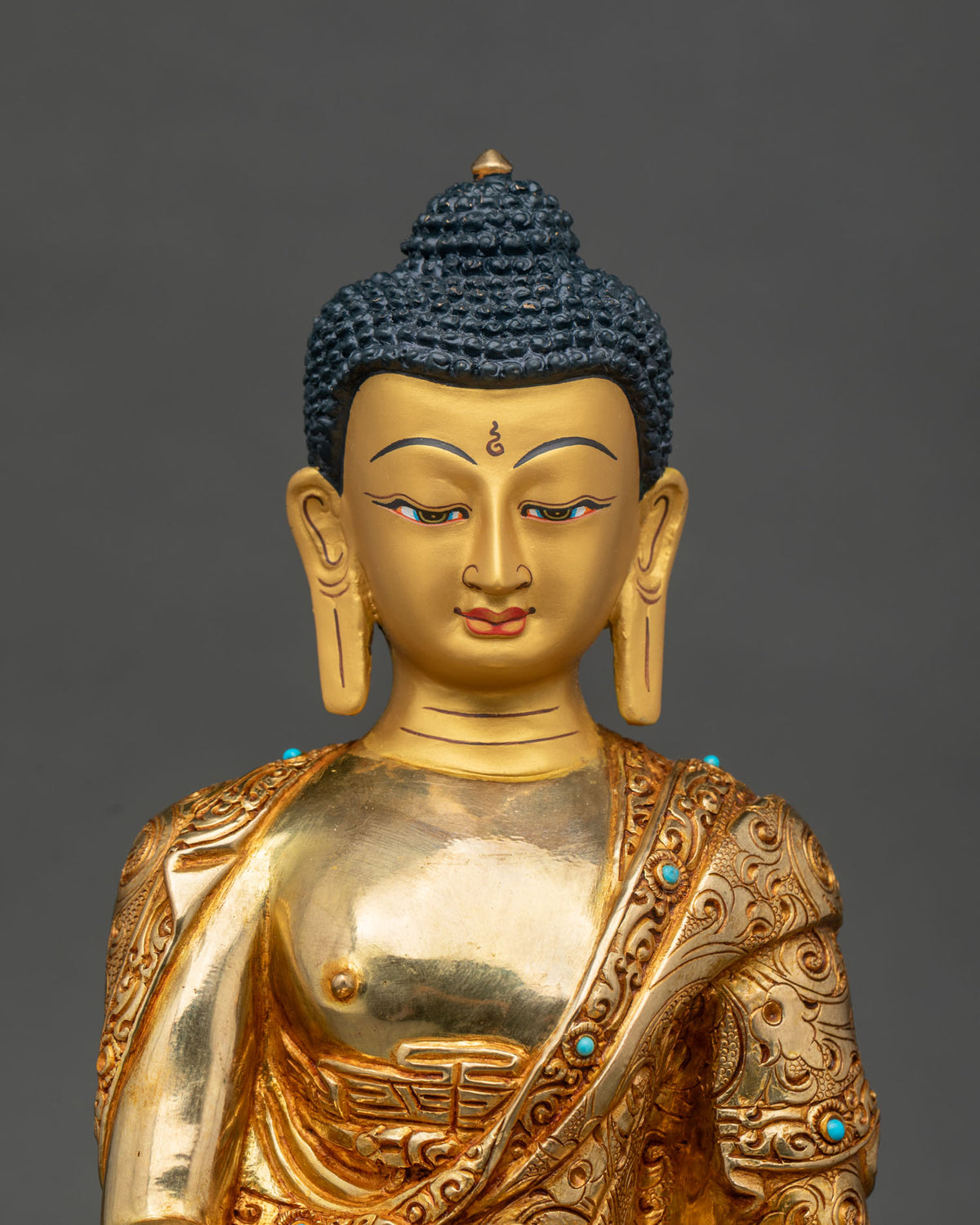 Shakyamuni Buddha statue 24K gold painted face semi precious stones.
