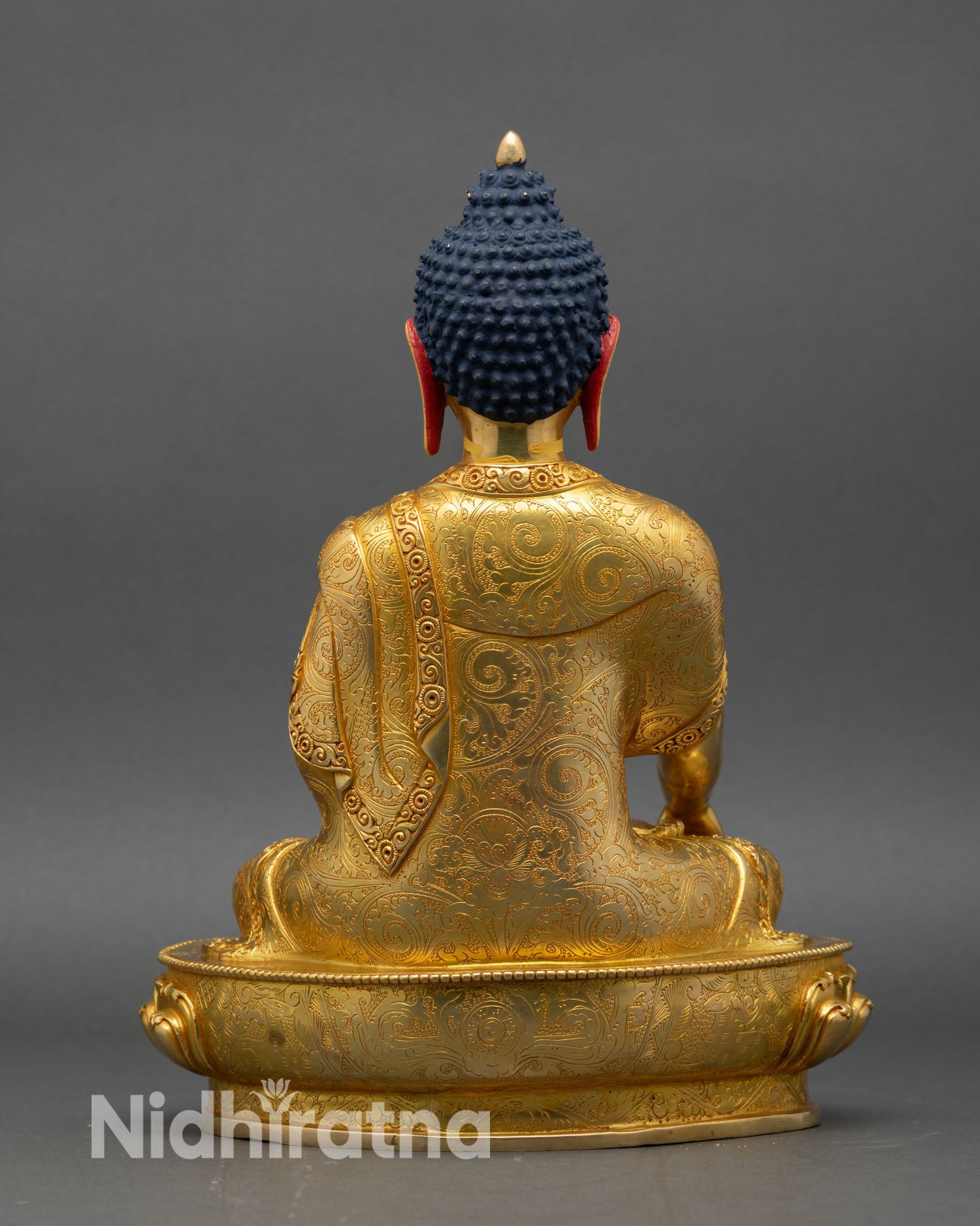 shakyamuni buddha statue back view, detailed lotus pedestal and engraved copper design