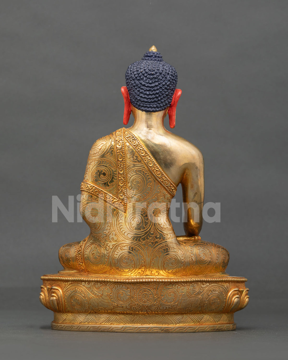 Shakyamuni Buddha Statue back view gold gilded copper Newari art Patan Nepal.