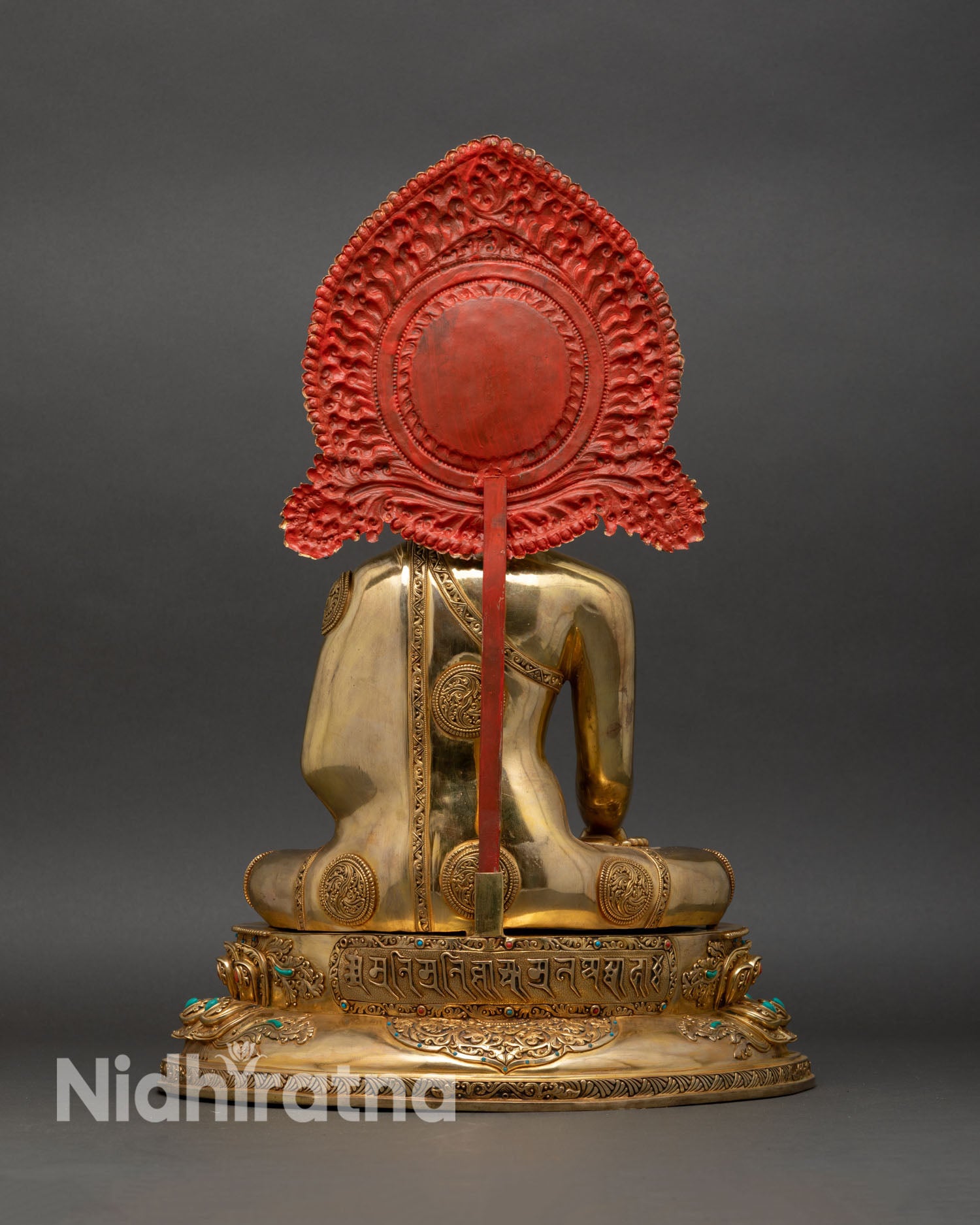 Shakyamuni Buddha statue back view lotus throne engraved petals fire-gilded copper Nepal