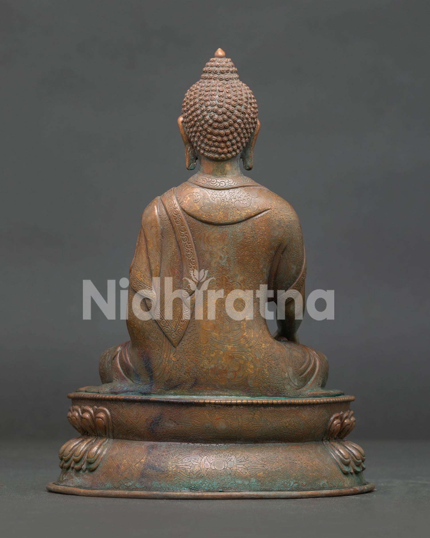 Shakyamuni Buddha statue back view showing traditional Newari copper craftsmanship.