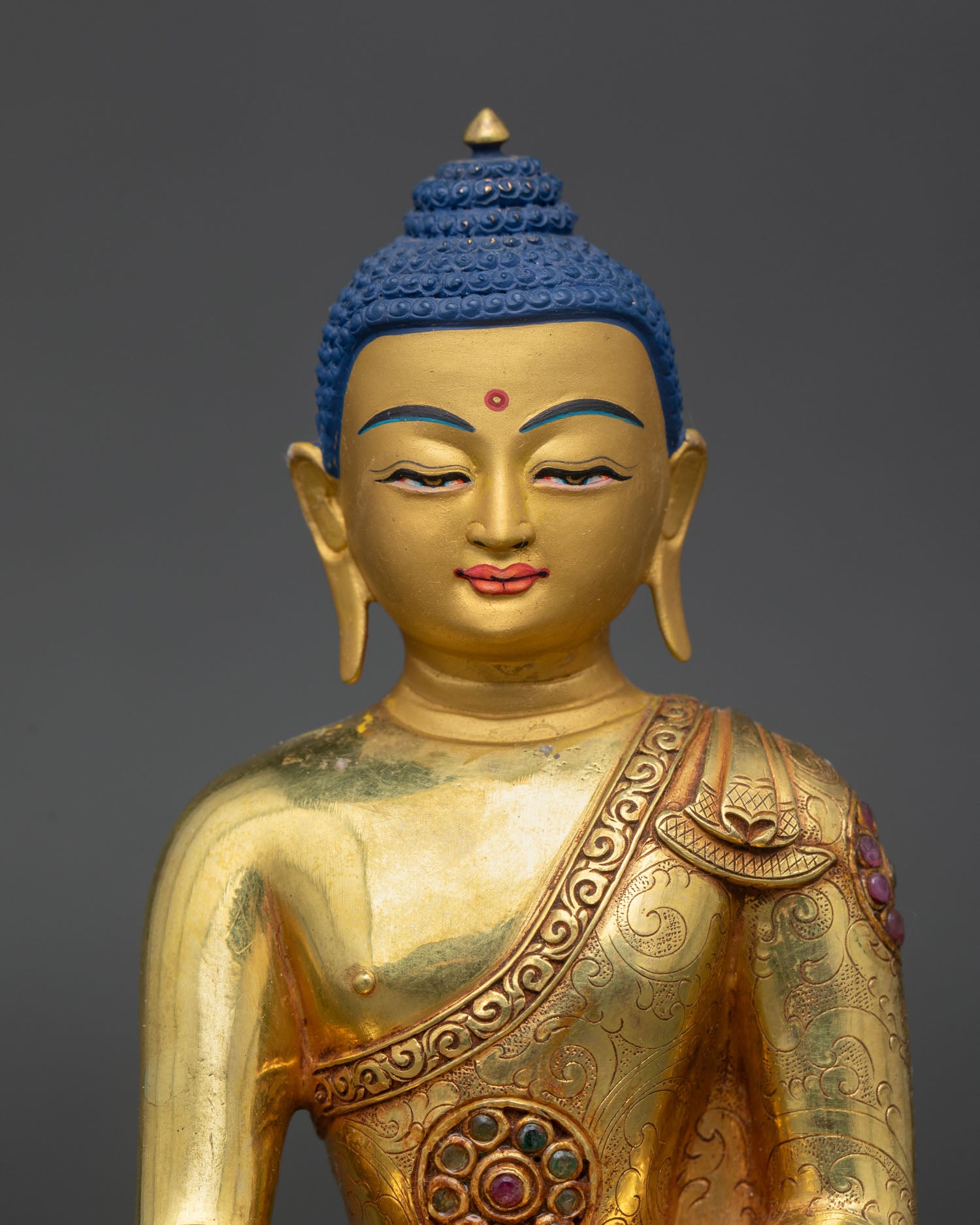 shakyamuni buddha statue close up copper 24k gold gilding detail buddhist altar art
