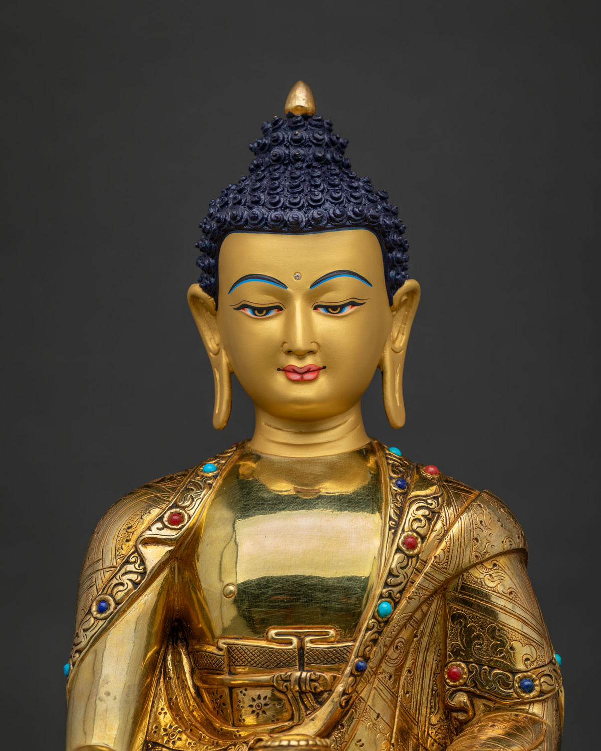 Shakyamuni Buddha Statue close-up showing gold fire-gilded copper robe detail