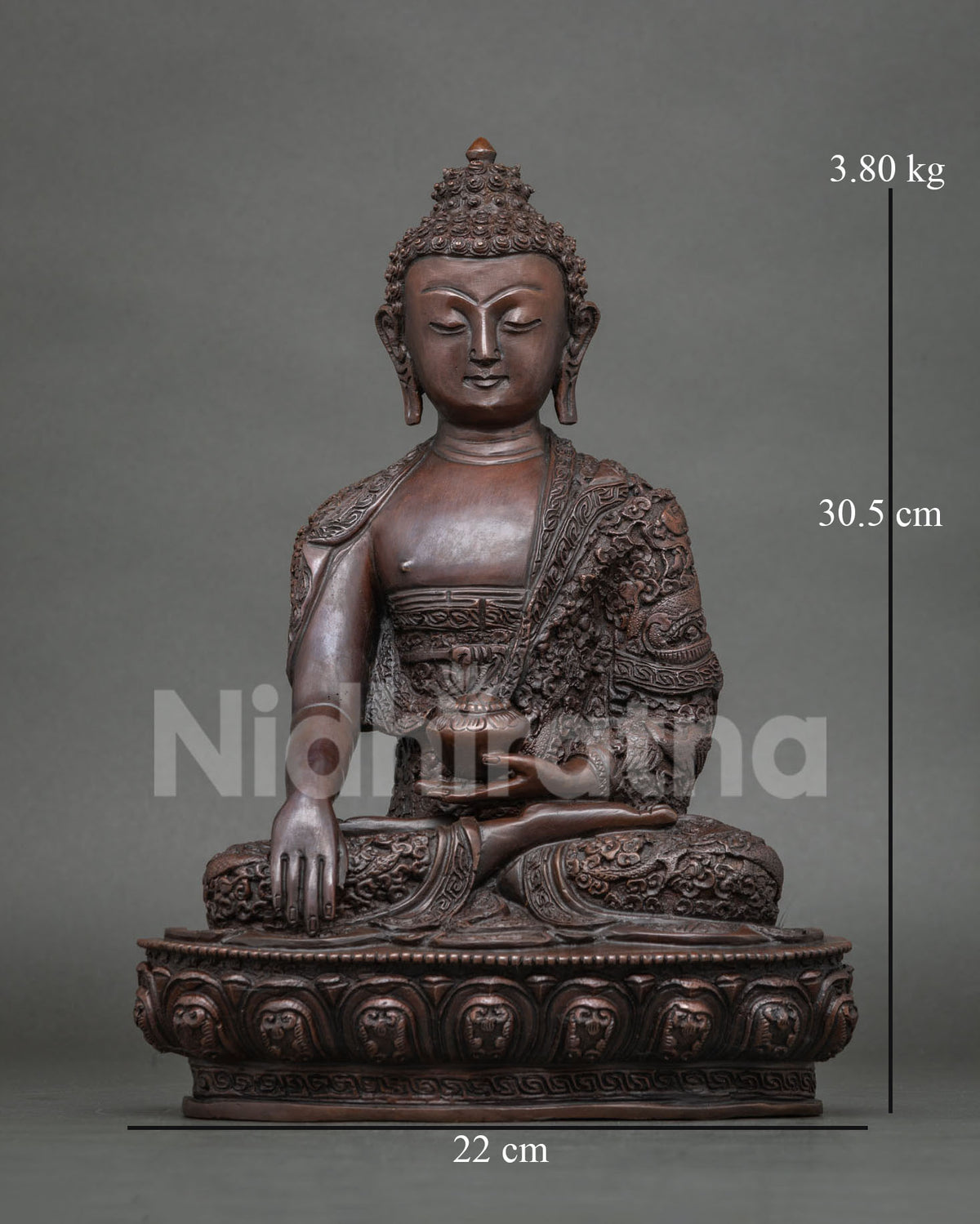 Shakyamuni Buddha statue made from copper with a chemically oxidized finish seated on a lotus pedestal handcrafted in Patan Nepal.
