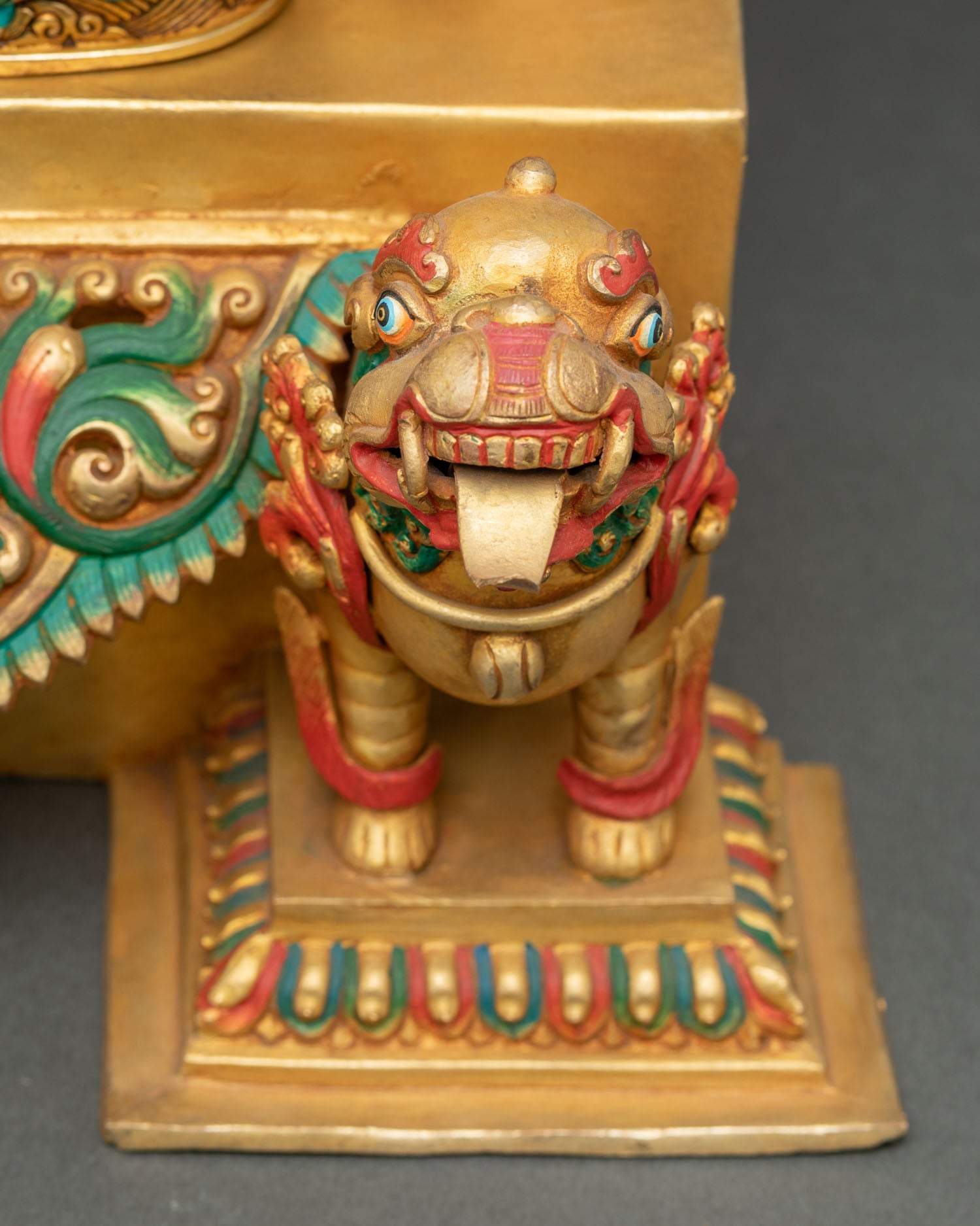 Shakyamuni Buddha statue detailed close-up of protective snow lions supporting lotus pedestal