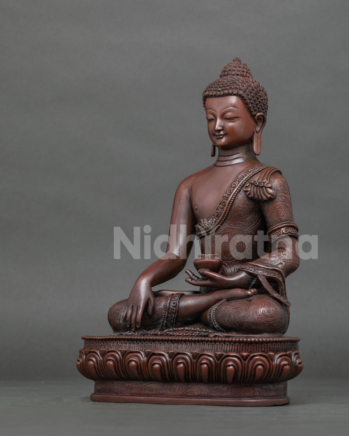 Shakyamuni buddha statue displaying earth touching mudra with handcarved monk robe.