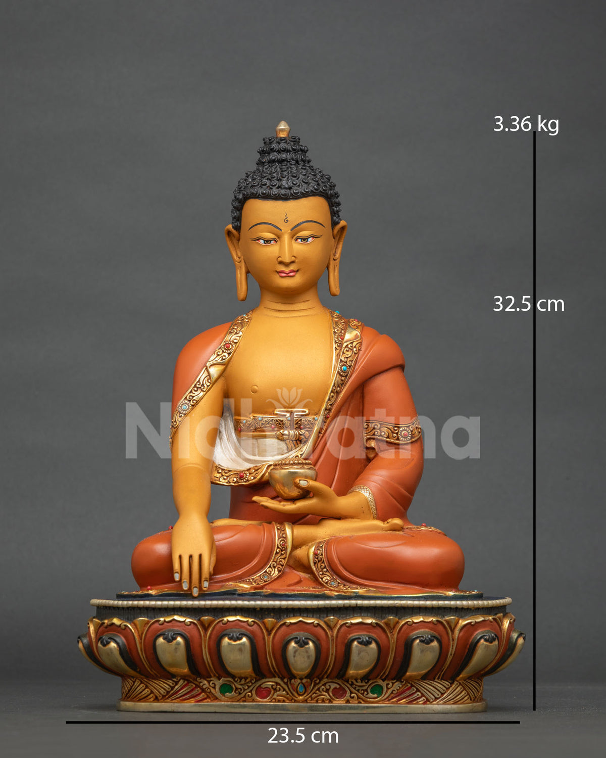 Shakyamuni Buddha statue from Nepal, front view with gold gilding on a lotus base