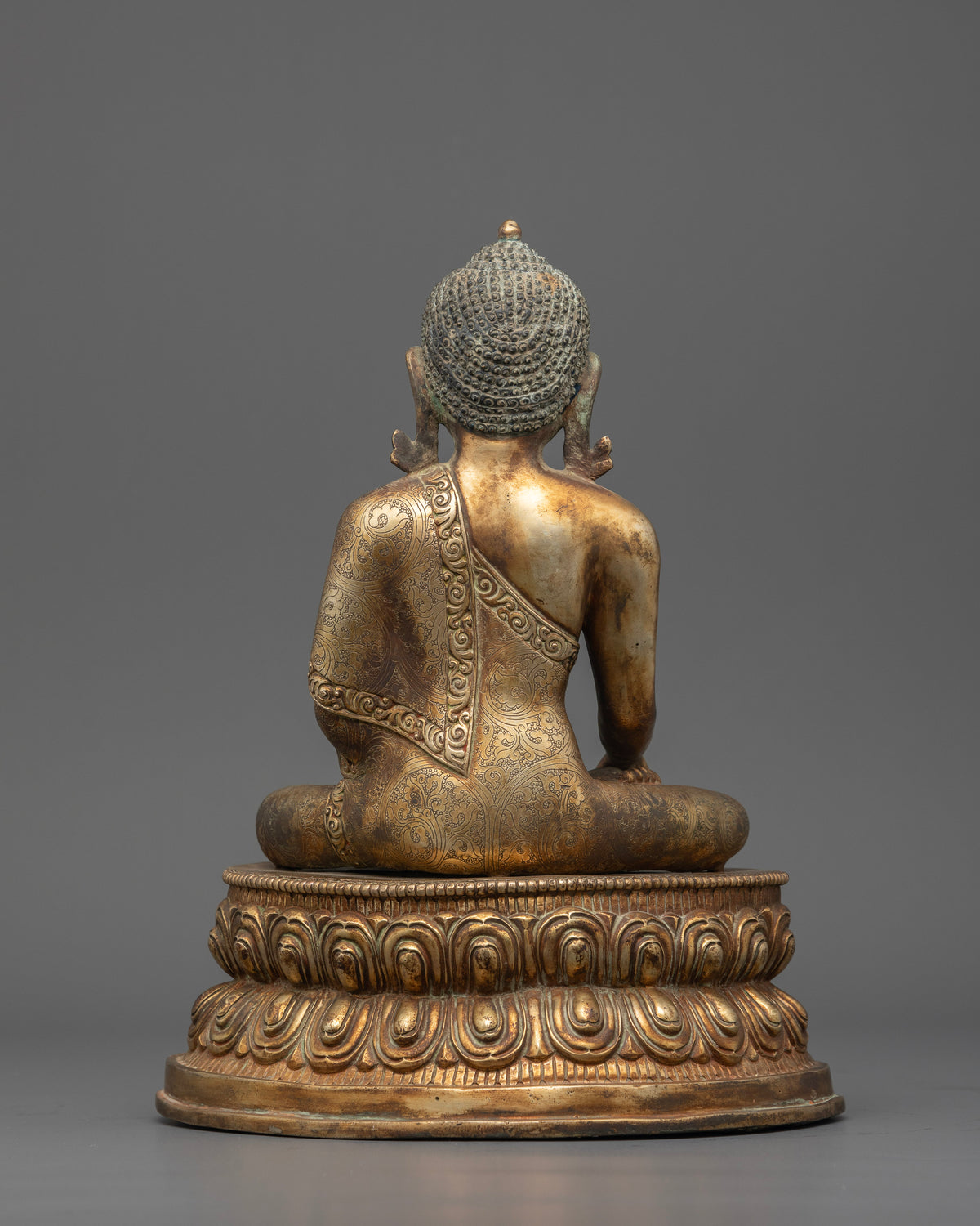 Shakyamuni Buddha statue hand carved floral robe and gold gilded details.