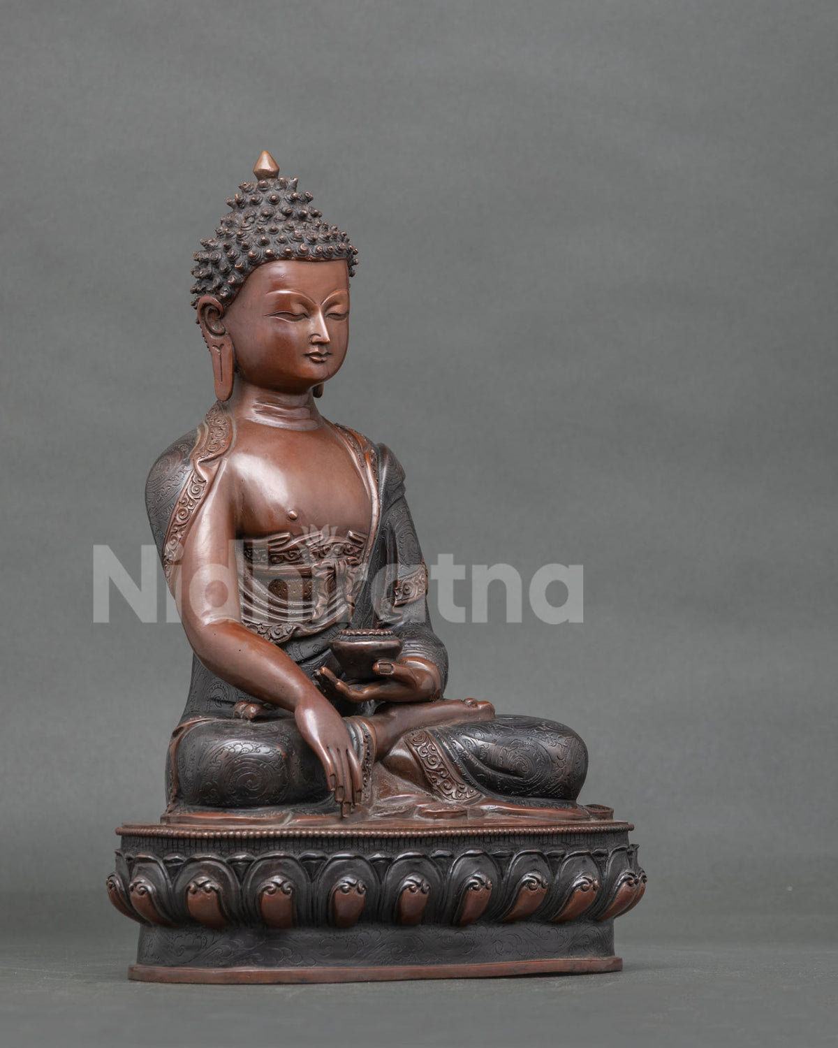 Shakyamuni Buddha statue seated on a hand carved lotus pedestal.