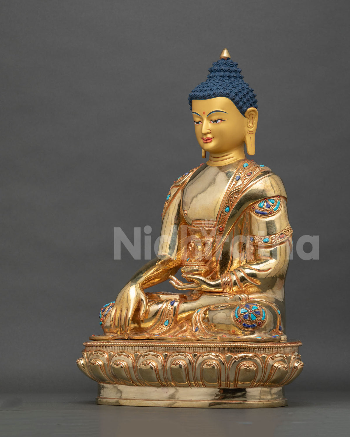 Shakyamuni Buddha statue hand carved monk robe begging bowl left side view.
