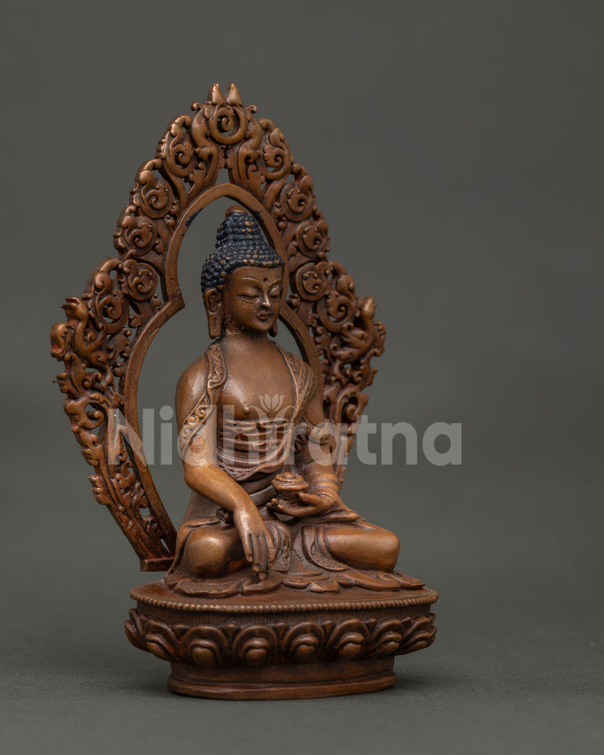 Shakyamuni Buddha statue holding begging bowl on hand carved lotus pedestal.