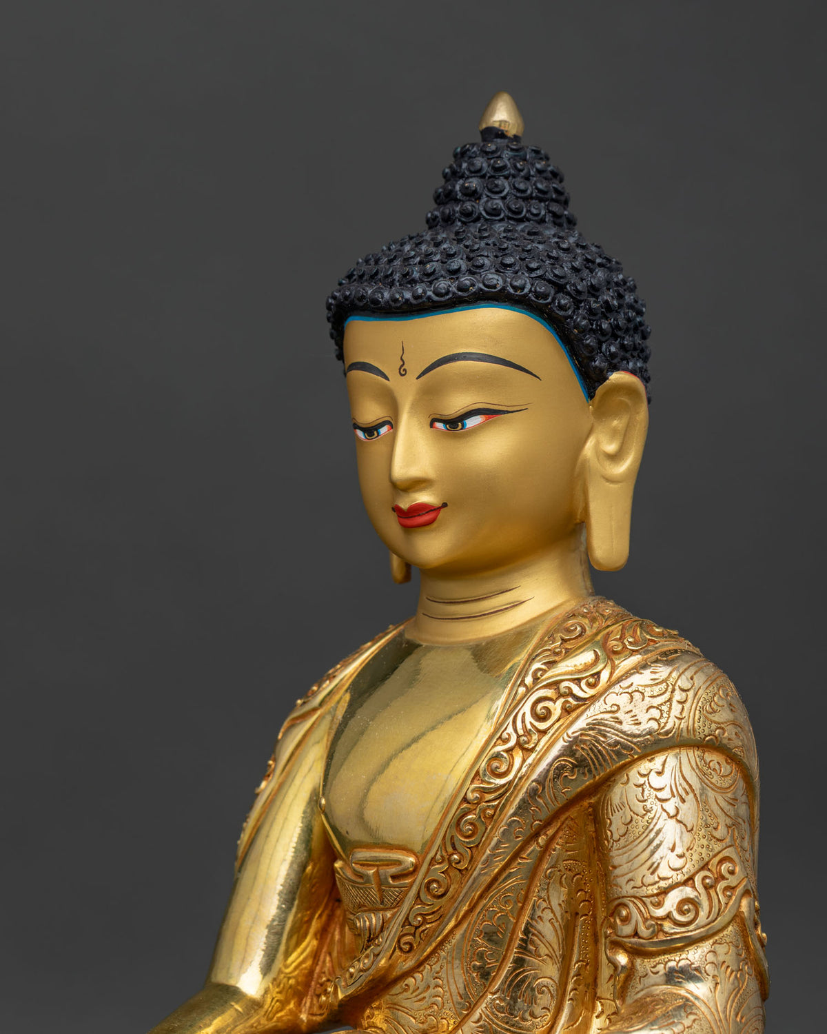 Shakyamuni Buddha statue intricate robe details side close up