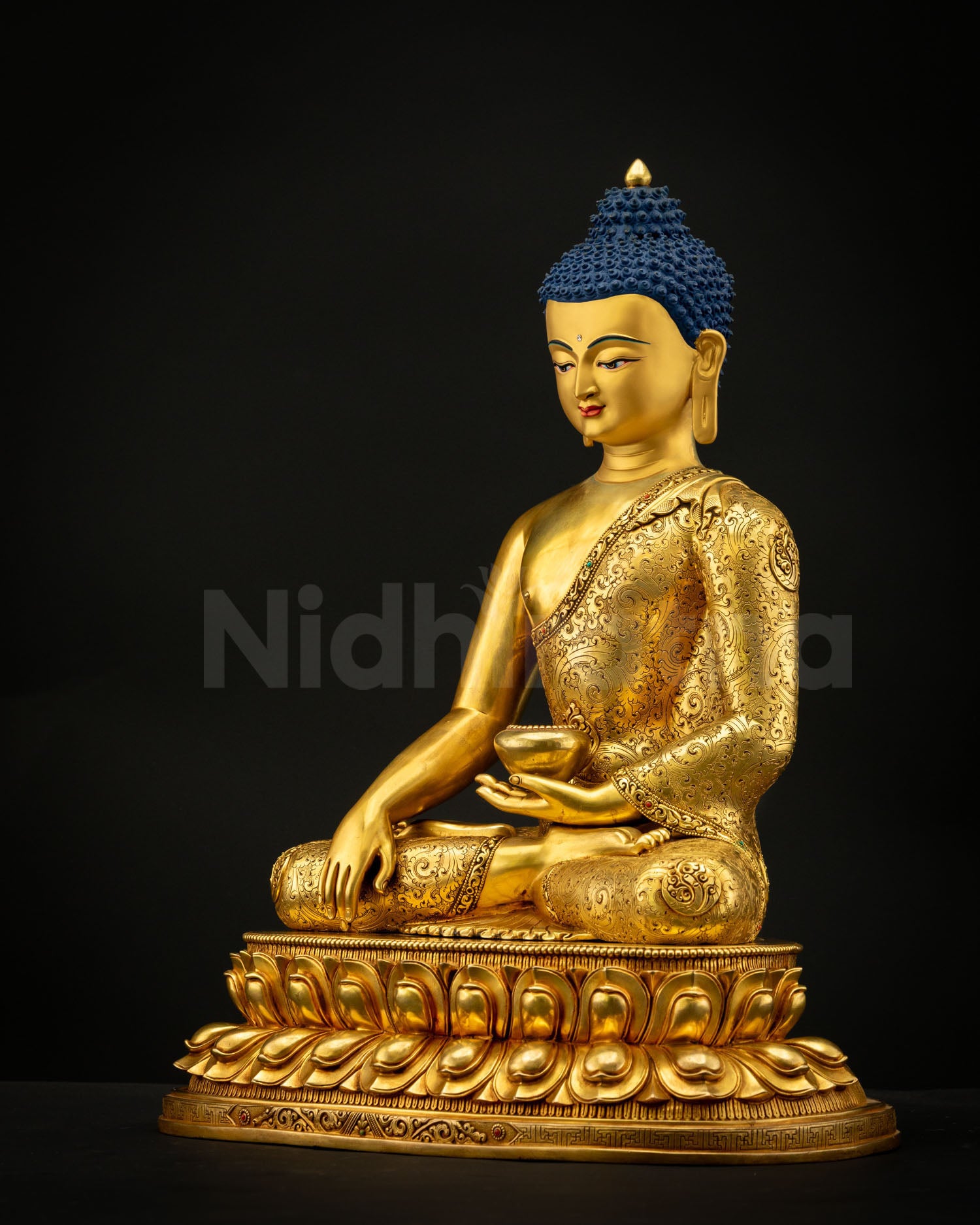 Shakyamuni Buddha Statue on double lotus pedestal with radiant gold gilding, spiritual aura, and sacred meditation altar presence.