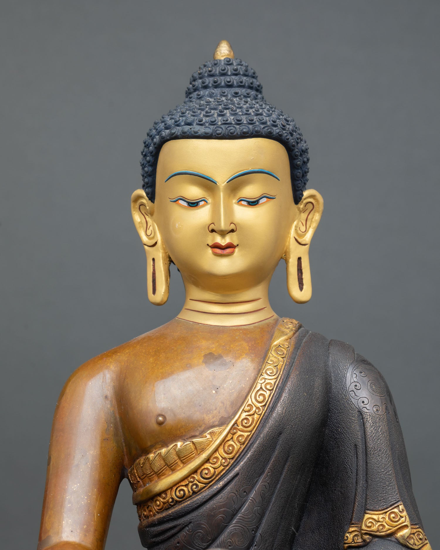 Shakyamuni Buddha Statue Regular Close Up Gold Painted Face Serene Meditative Eyes