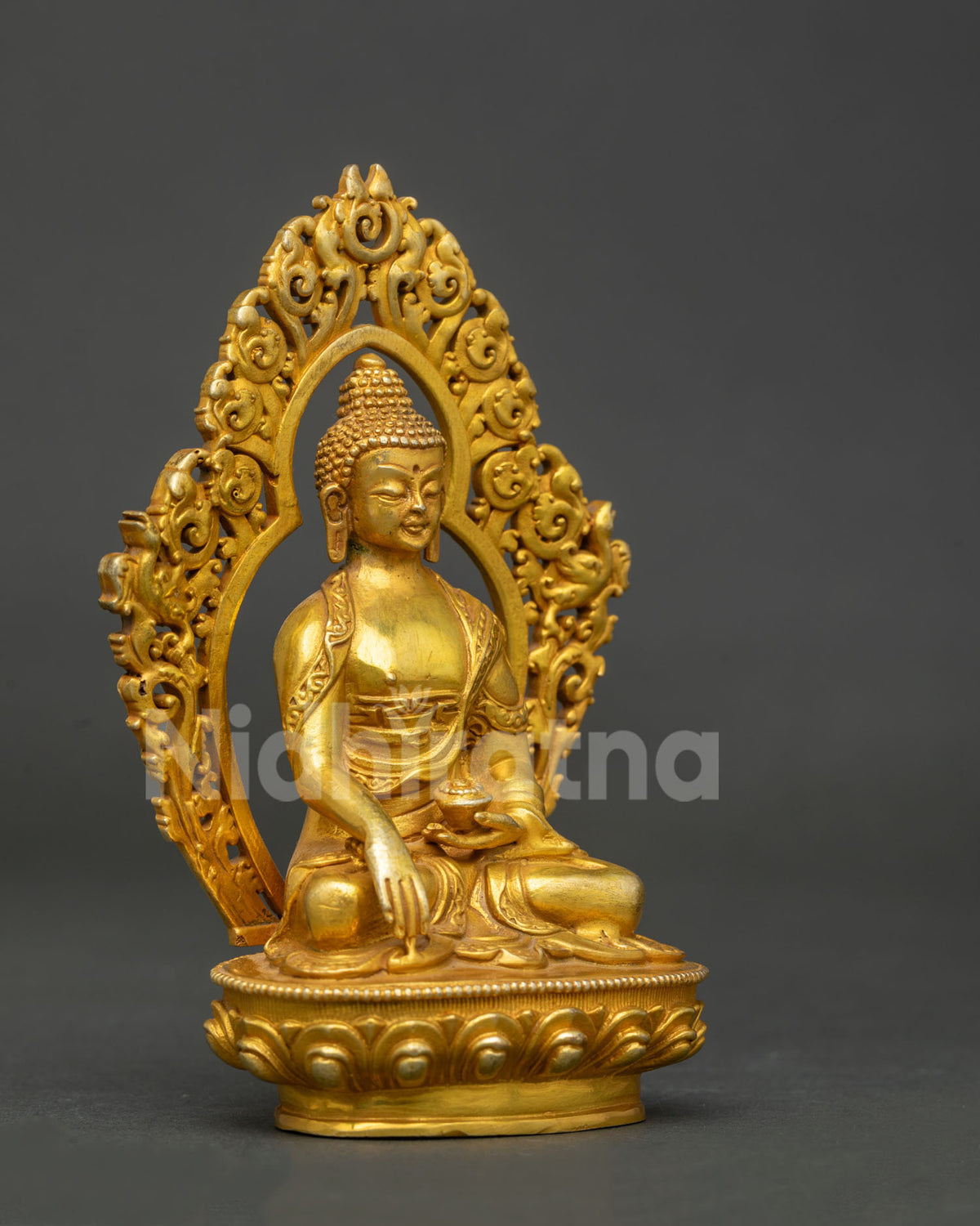 Shakyamuni Buddha statue seated on hand carved lotus pedestal with ornate halo.