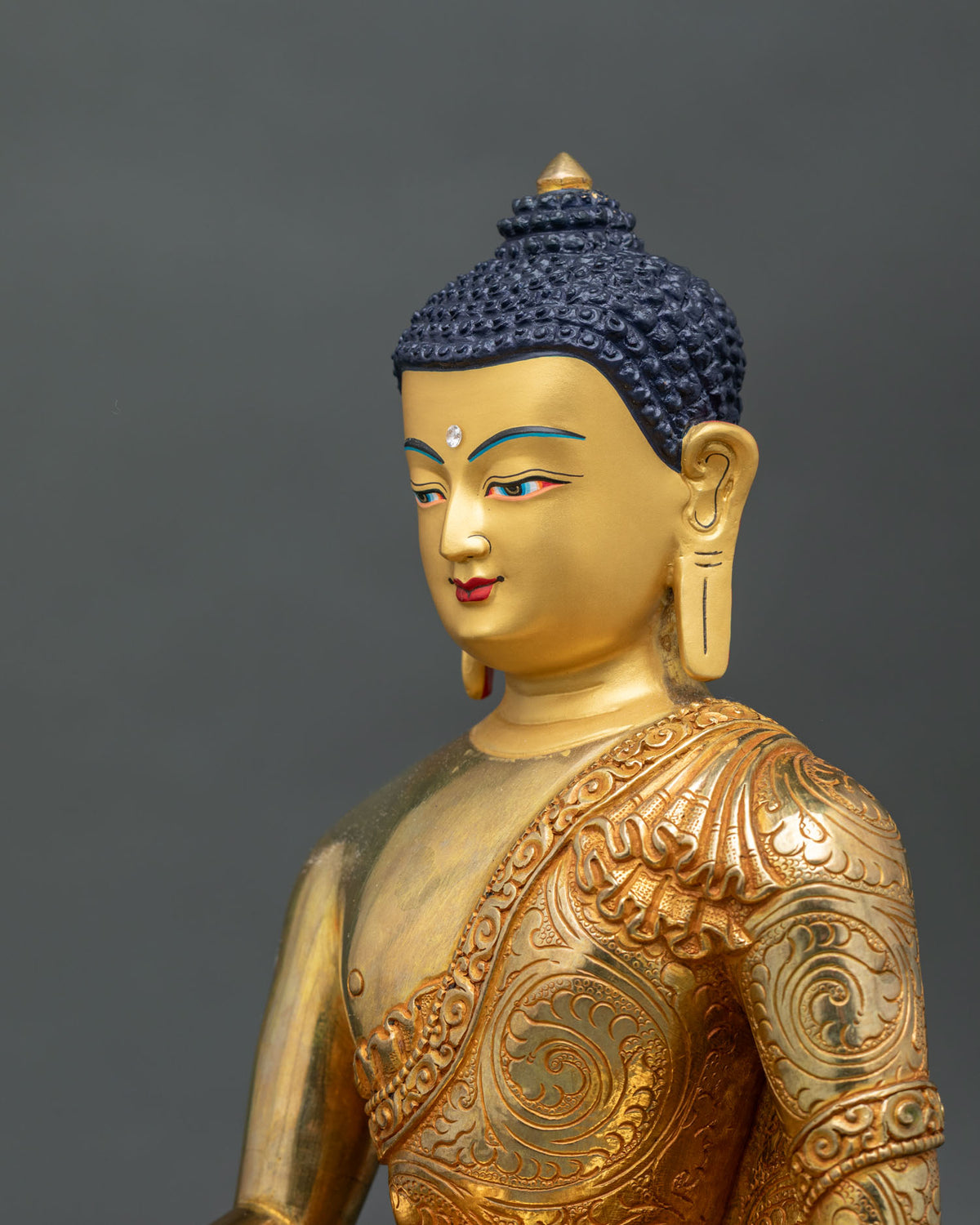 Shakyamuni Buddha Statue side face gold fire gilded monk robe floral motifs.