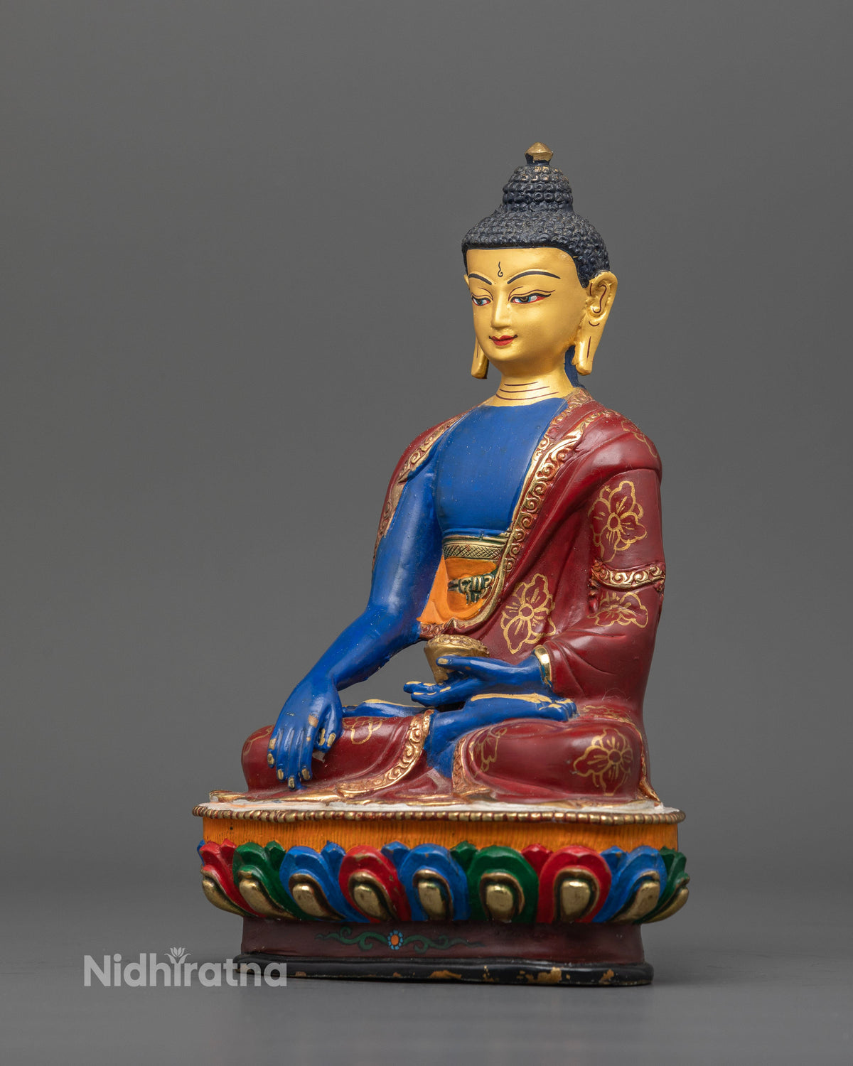 Shakyamuni Buddha statue with hand carved floral robe and gold gilded details.