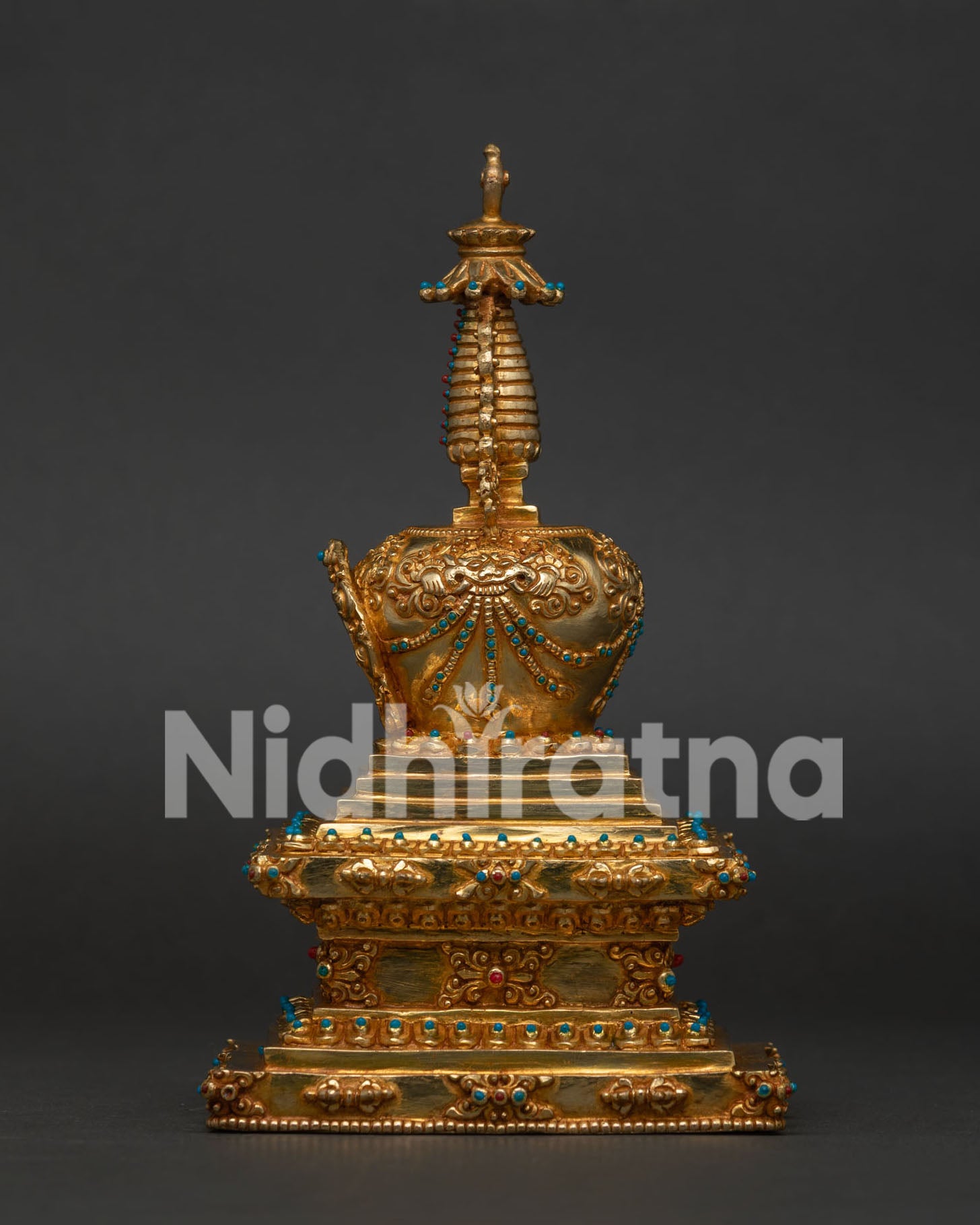 Shakyamuni Buddha Stupa with intricate gold details and gemstone work