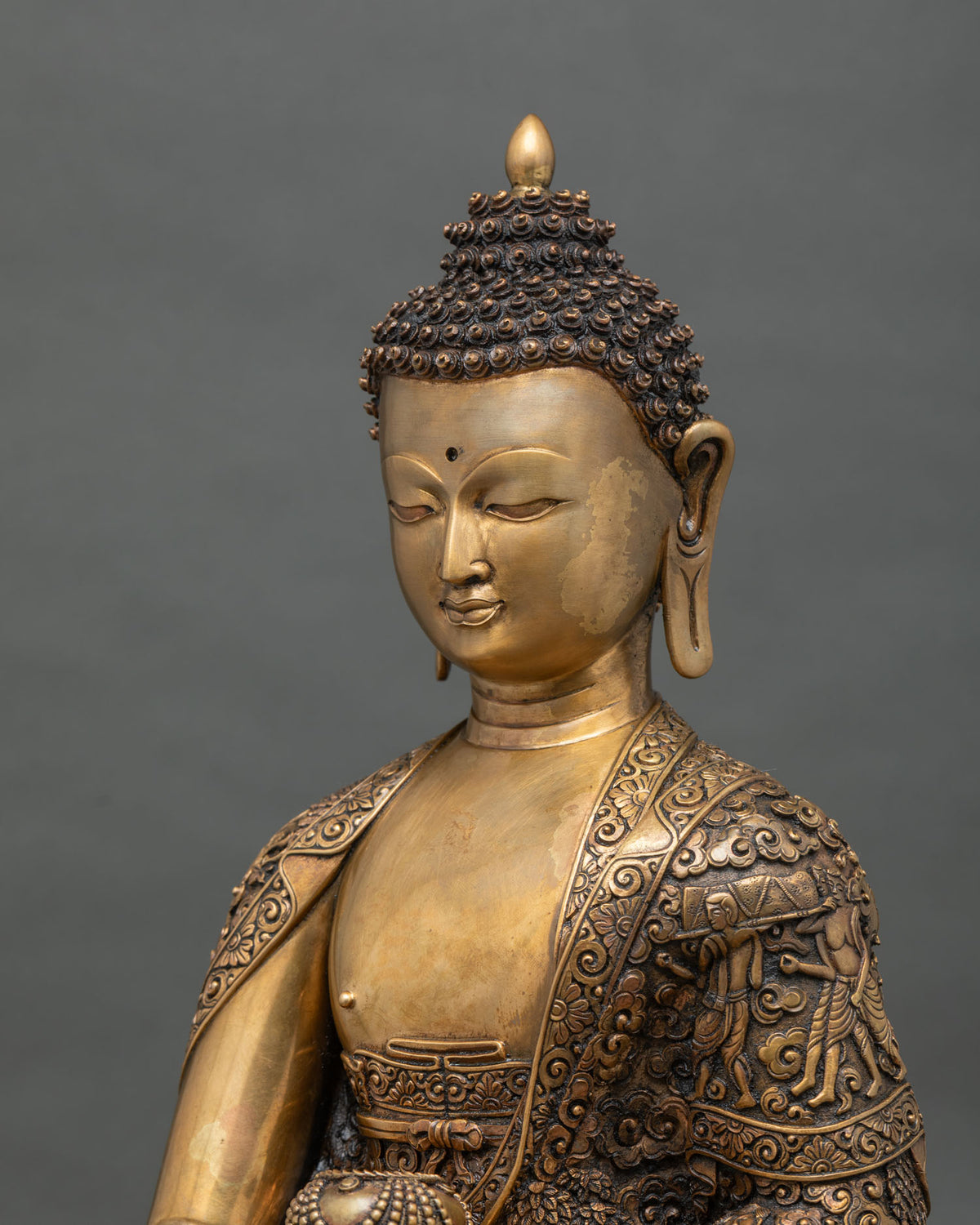 Side Close Up of Shakyamuni Buddha Statue Showing Hand-Chased Copper Monastic Robe Carvings