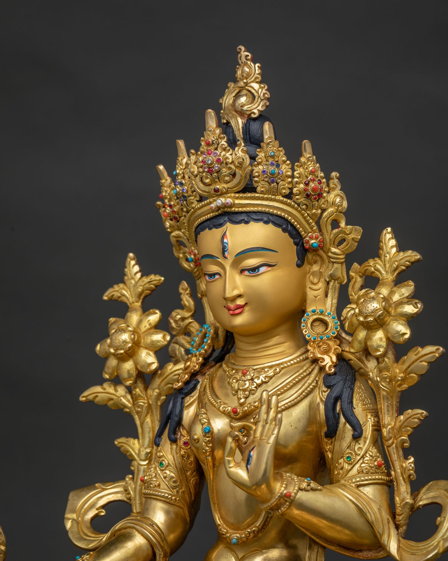 Side close up of White Tara Statue highlighting ornate Himalayan craftsmanship