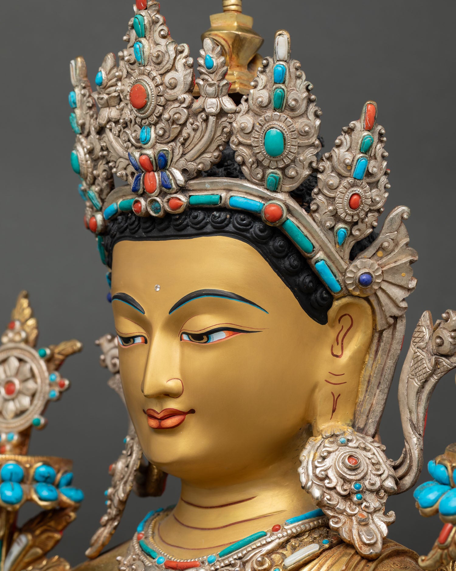 Side face close up Maitreya Buddha Statue, elegant gold painted profile, Himalayan craftsmanship detail