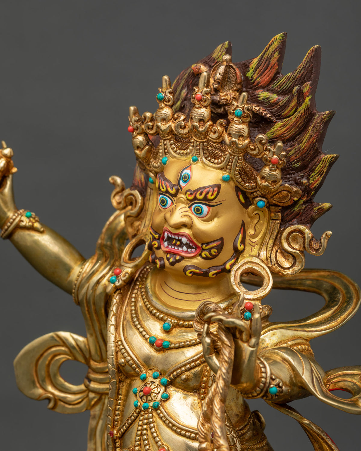 Vajrapani statue side close up, tiger-skin garment, jeweled belt and blazing halo, gold fire-gilded