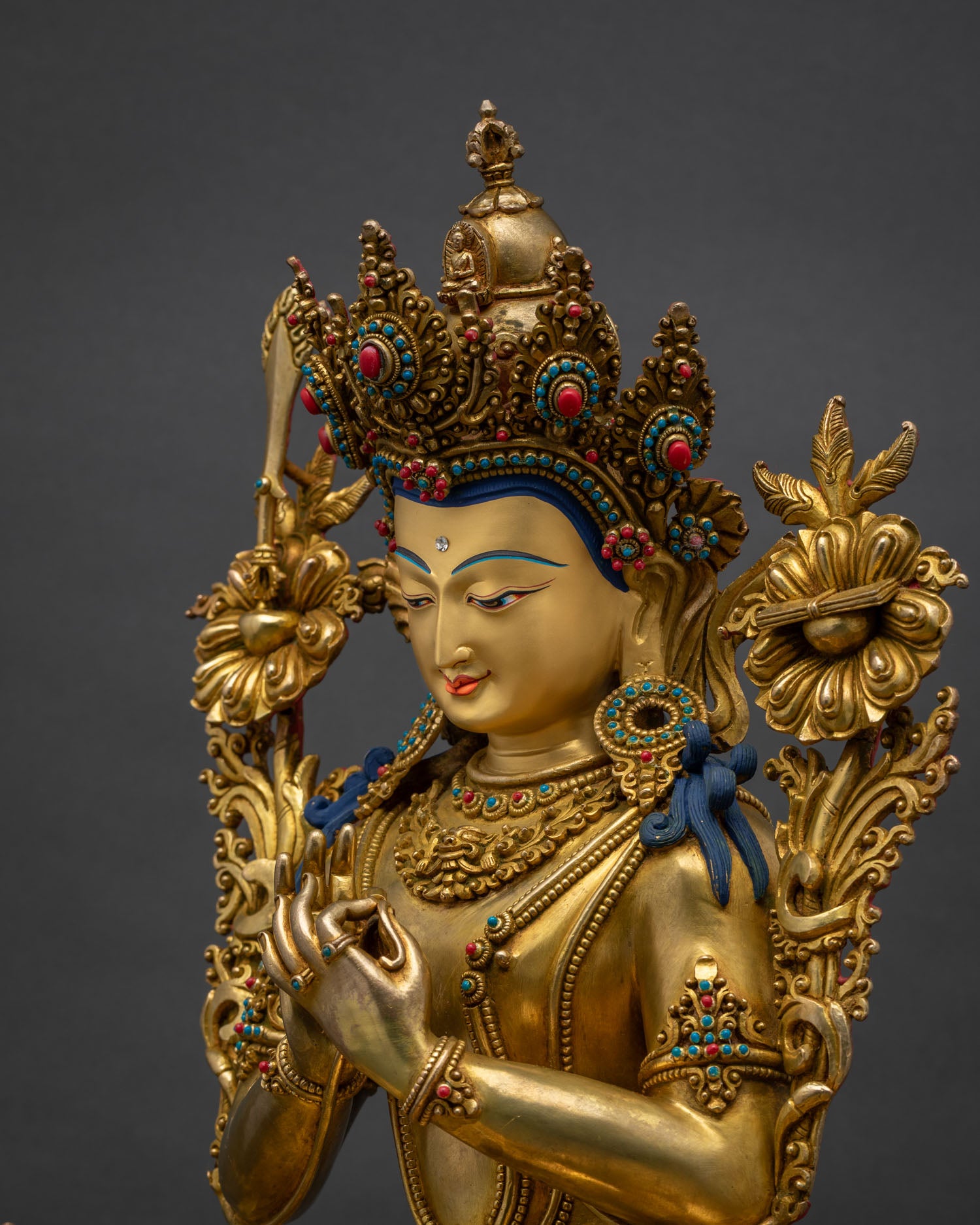 Side profile of hand-carved gold fire-gilded Tikshna Manjushri sculpture