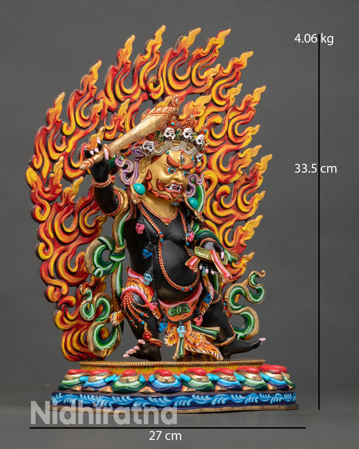 Side view of Black Manjushri statue holding flaming sword and Prajnaparamita text with halo