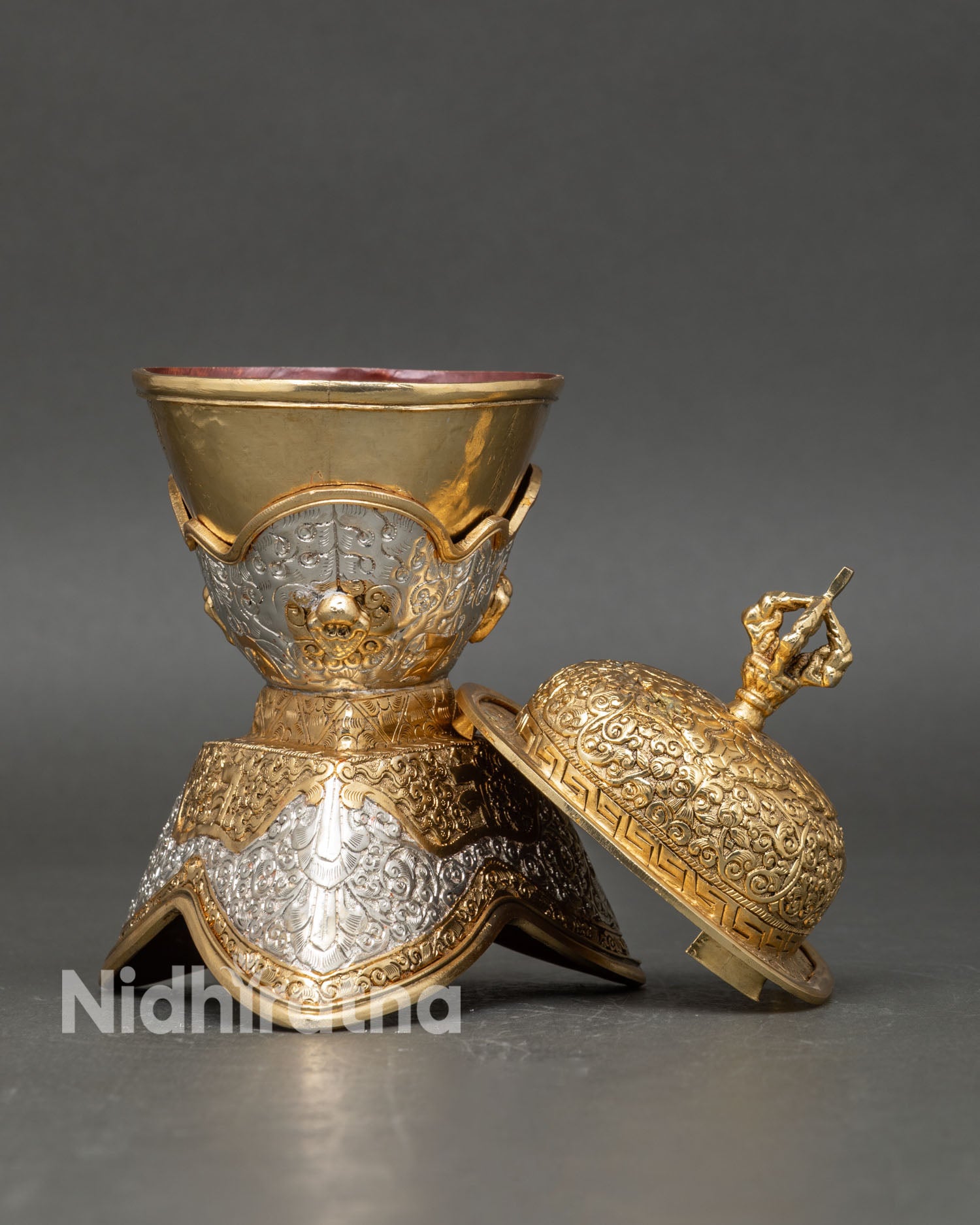 Side view of ceremonial Kapala skull cup set displaying dual structure ritual vessel with ornamental base gold silver plated finish