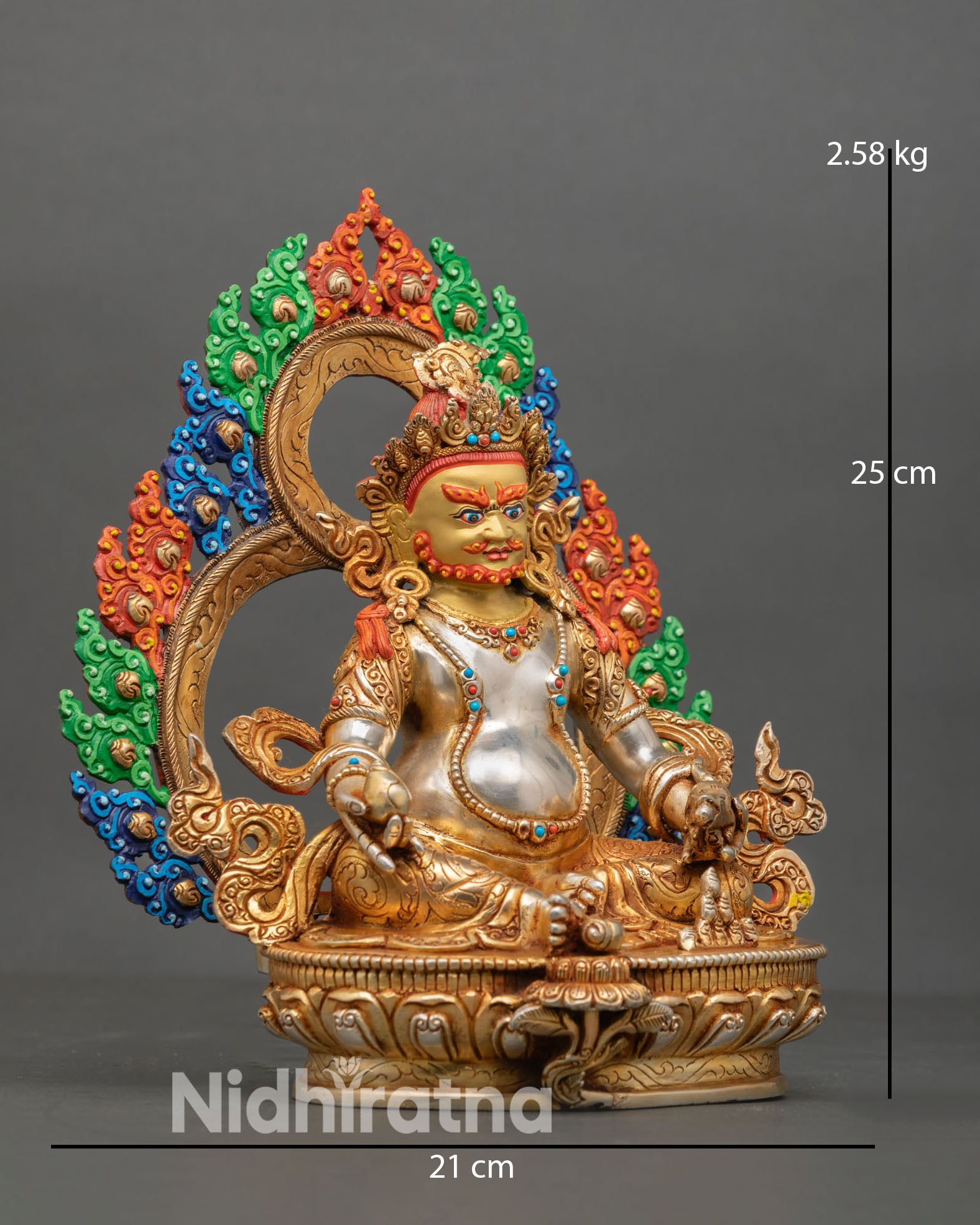 Side view of Dzambhala statue seated on lotus pedestal with decorated halo holding mongoose and citron symbol wealth deity sculpture