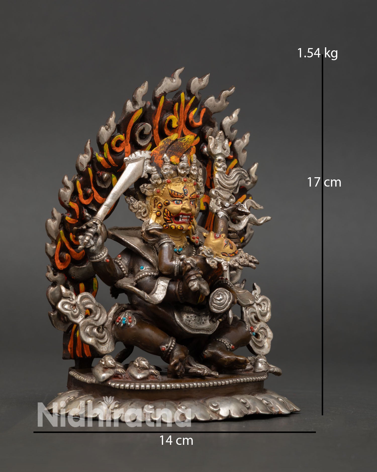 Side view of Four-Armed Mahakala statue oxidized copper silver accents dynamic posture ritual protector Buddhist sculpture Nepal