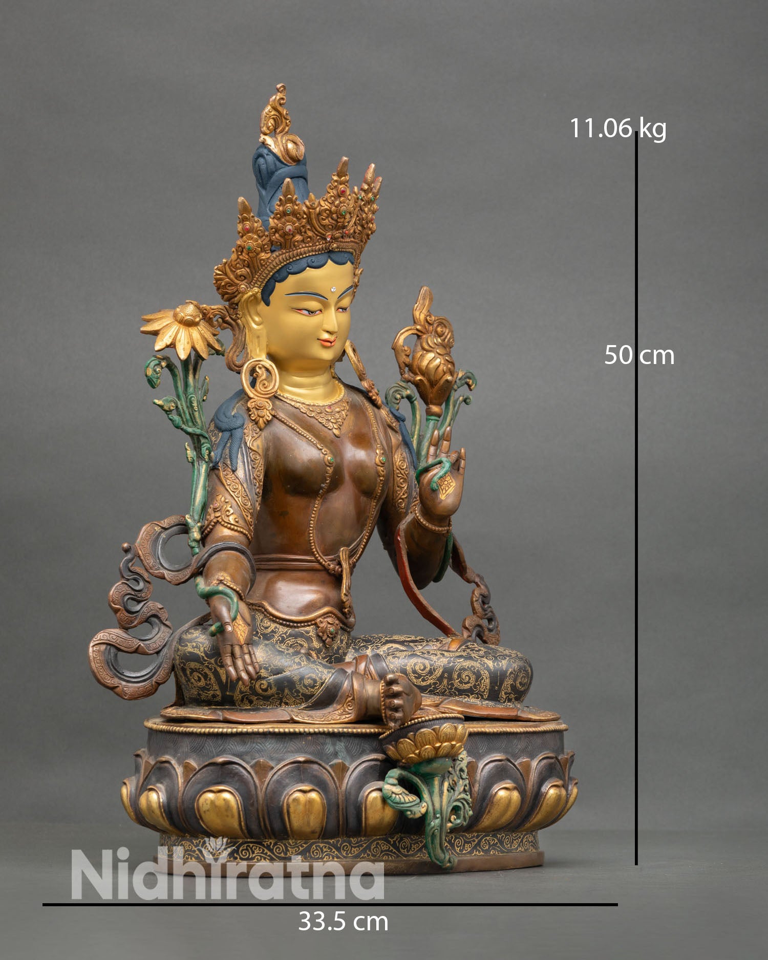 Side view Green Tara seated on lotus pedestal holding lotus flowers Varada and Abhaya mudra Himalayan Buddhist copper sculpture