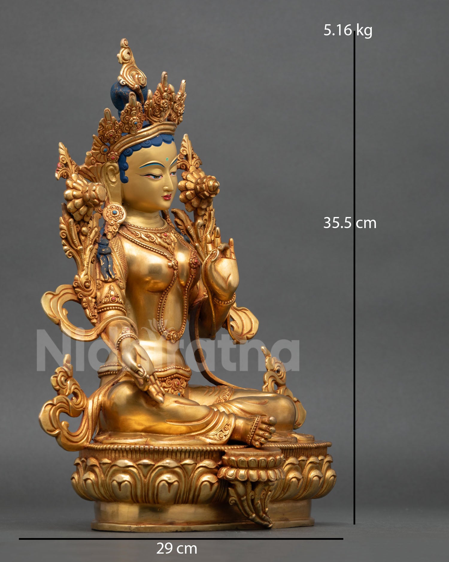 Side view of Green Tara seated posture of swift compassion copper statue with flowing ornaments 24K gold gilded finish