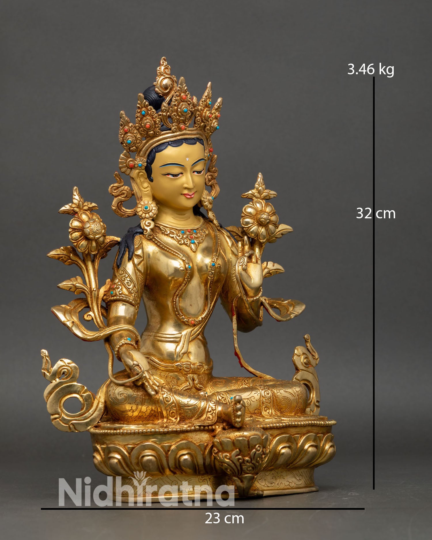 Side view of Green Tara statue extended right foot lotus blossoms copper art
