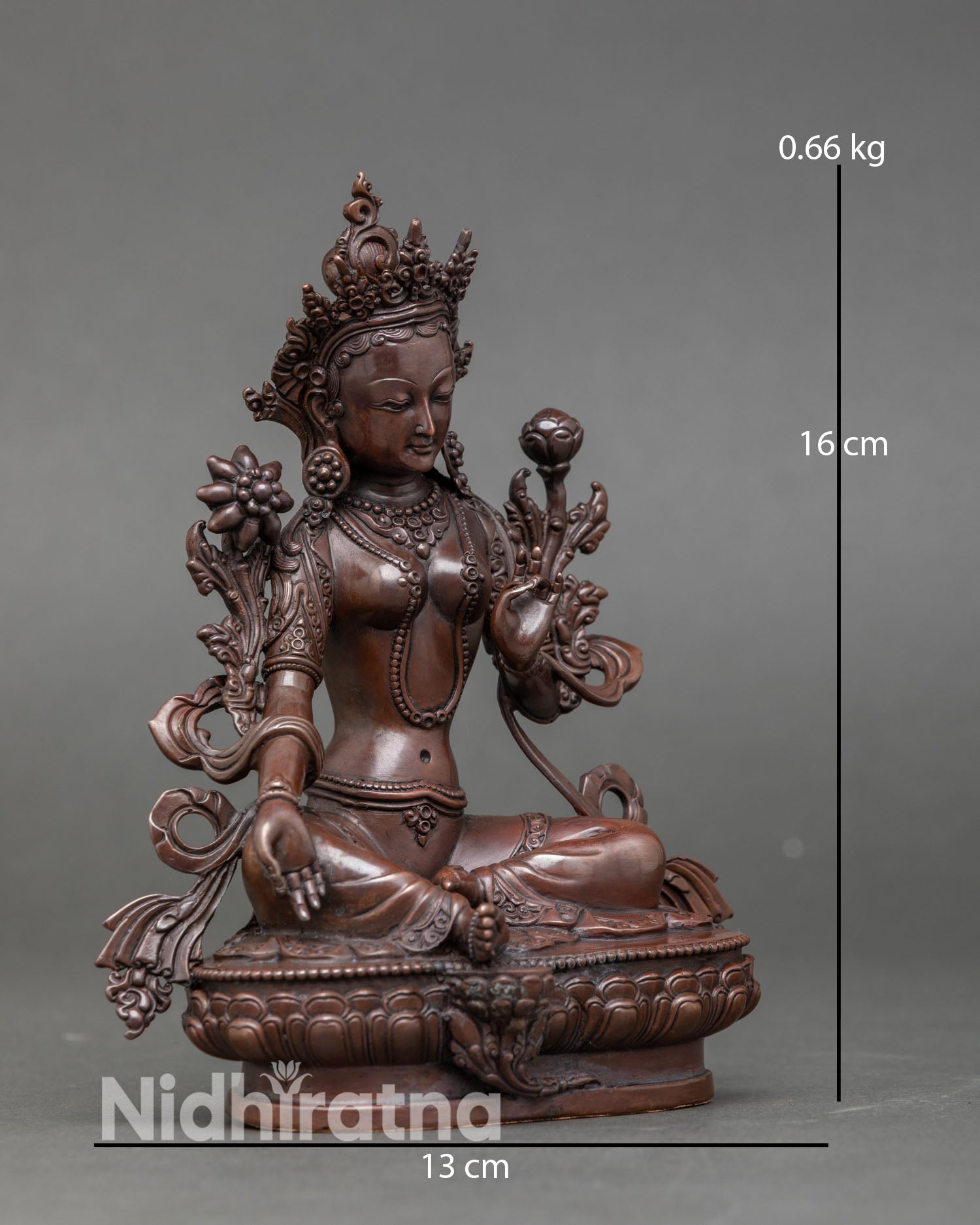 Side view of Green Tara statue Nepal handcrafted copper sculpture with antique oxidized finish right foot extended compassionate action gesture