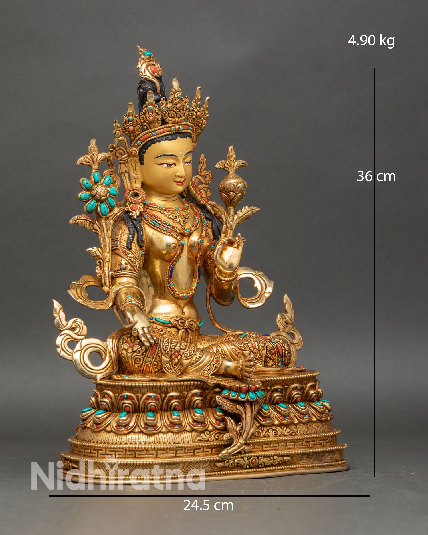 Side view Green Tara statue seated on double lotus pedestal with varada and abhaya mudras