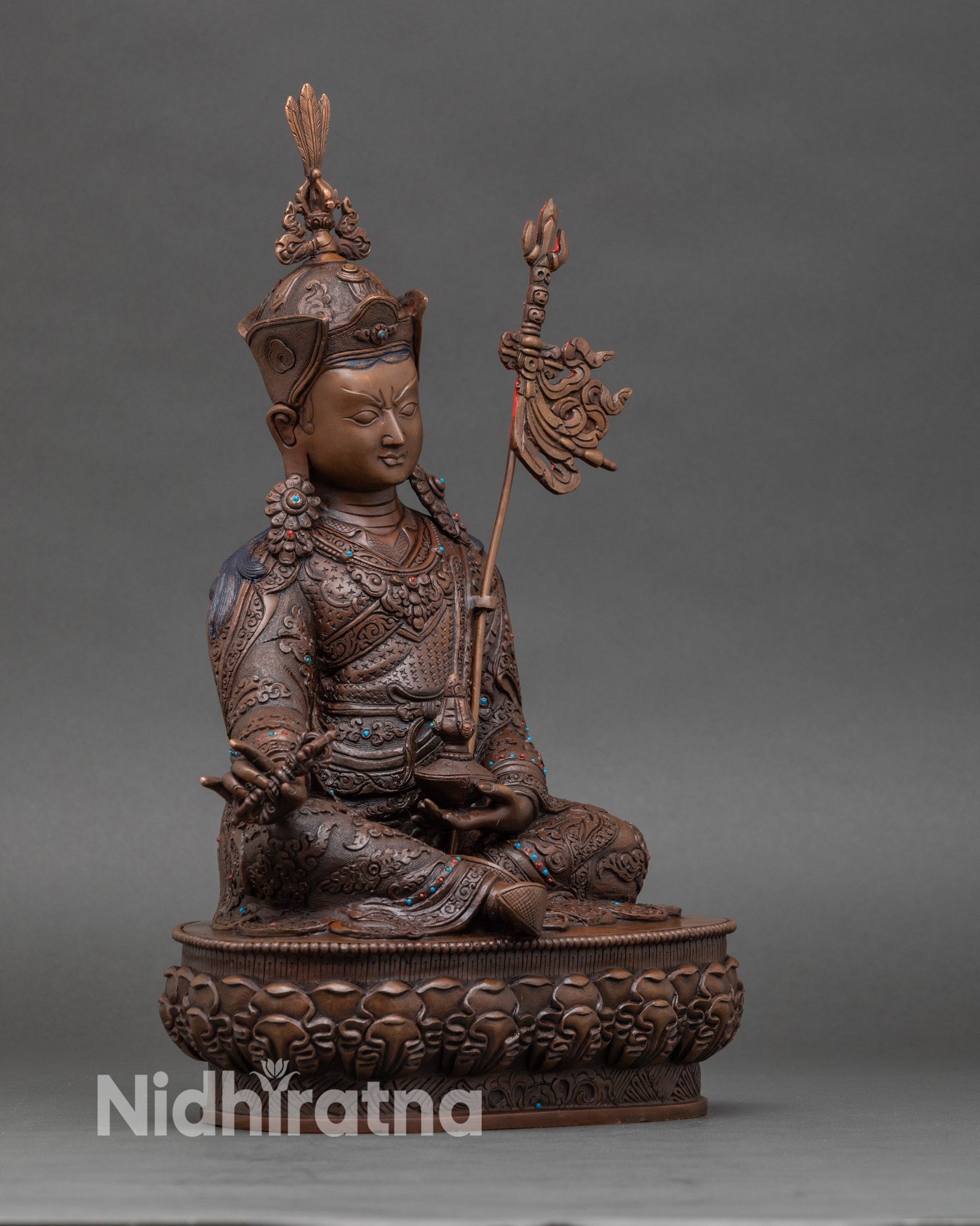 Side view Guru Rinpoche oxidized copper statue intricate craftsmanship turquoise coral stones