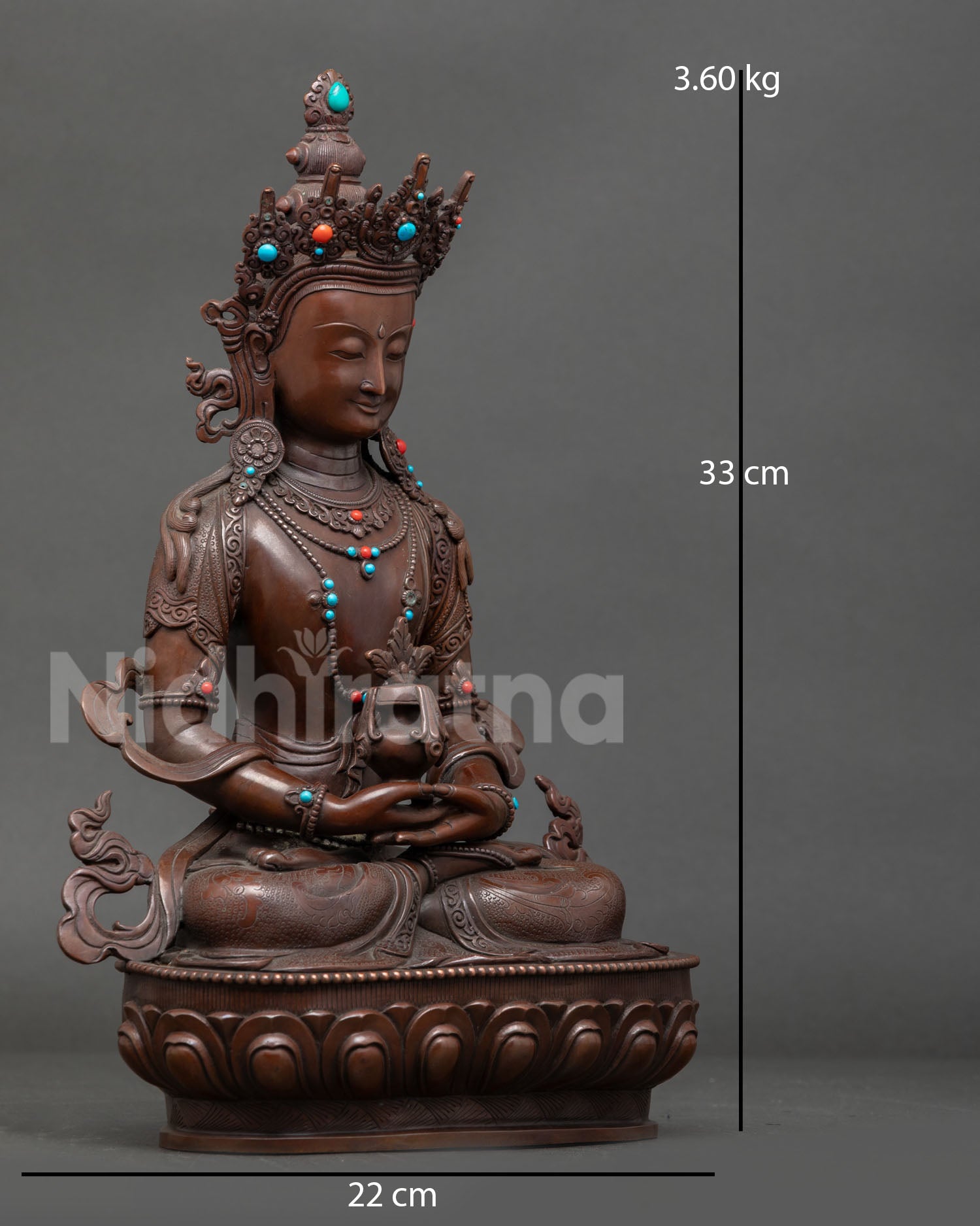 Side view of handmade Amitayus statue on lotus pedestal created by Newari artisan in Patan, Nepal, using lost wax casting method