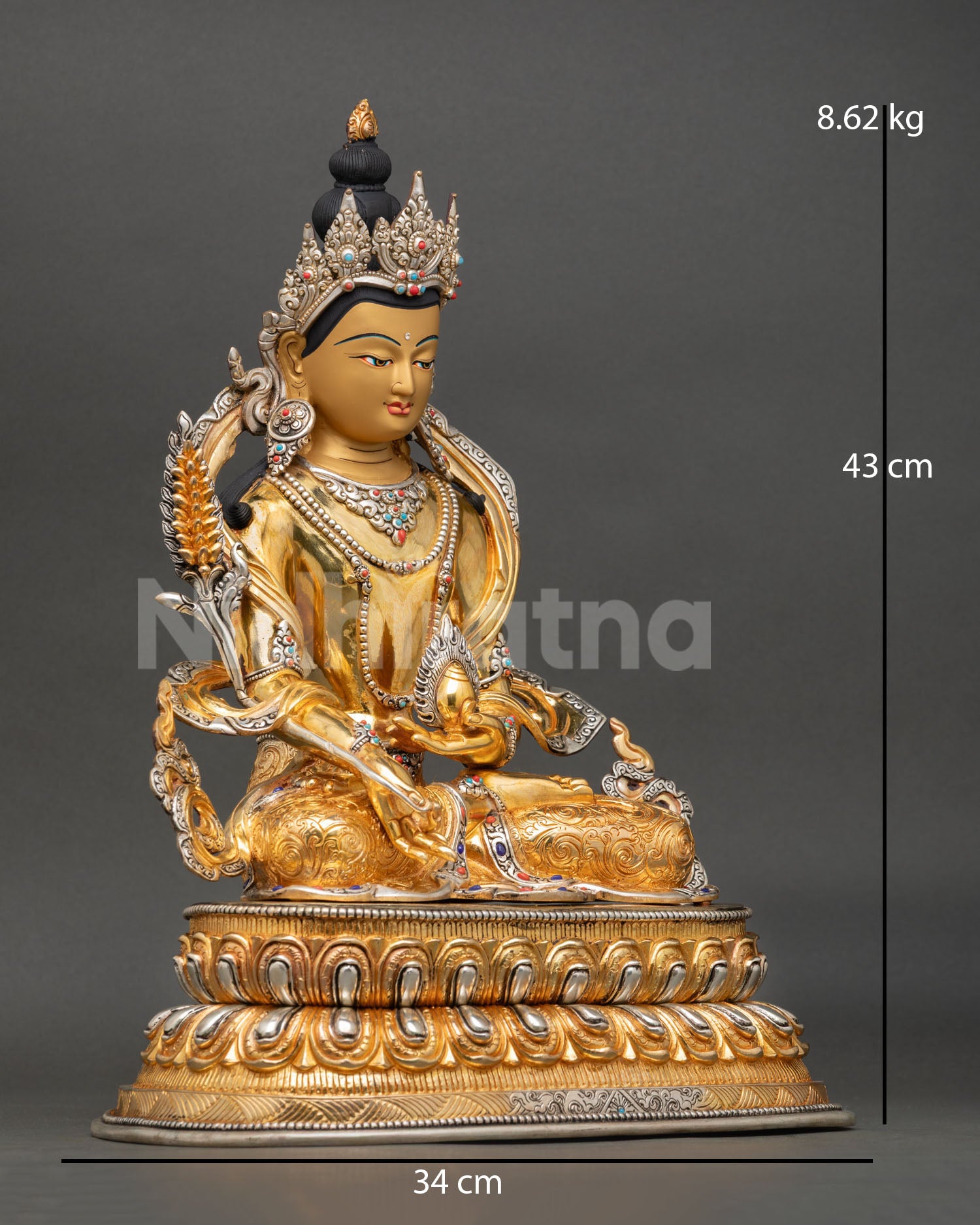 Side view of Kshitigarbha bodhisattva statue holding Cintamani jewel lotus pedestal sacred protector deity sculpture Himalayan spiritual altar art