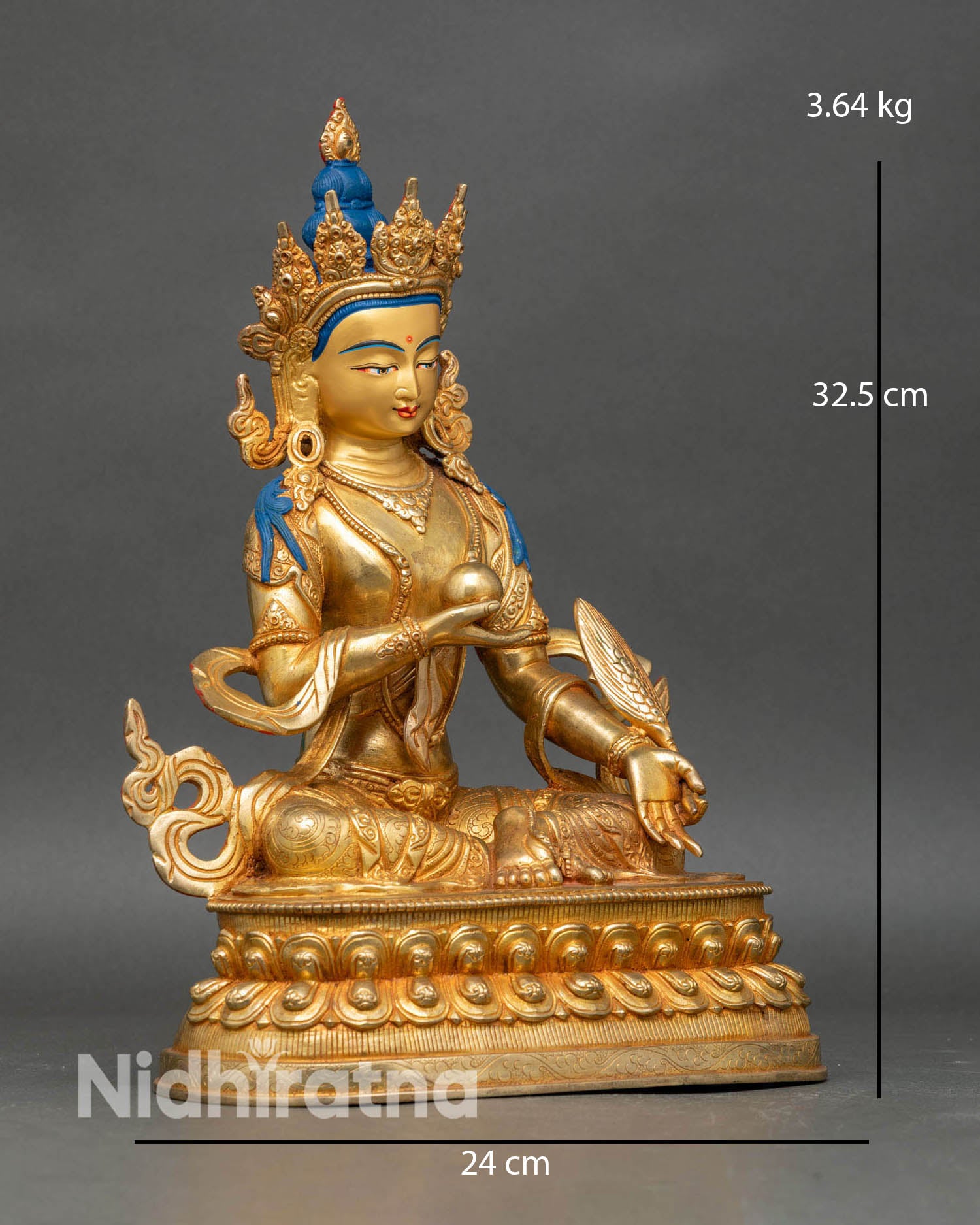 Side view Kshitigarbha statue holding Cintamani jewel, seated on lotus throne.