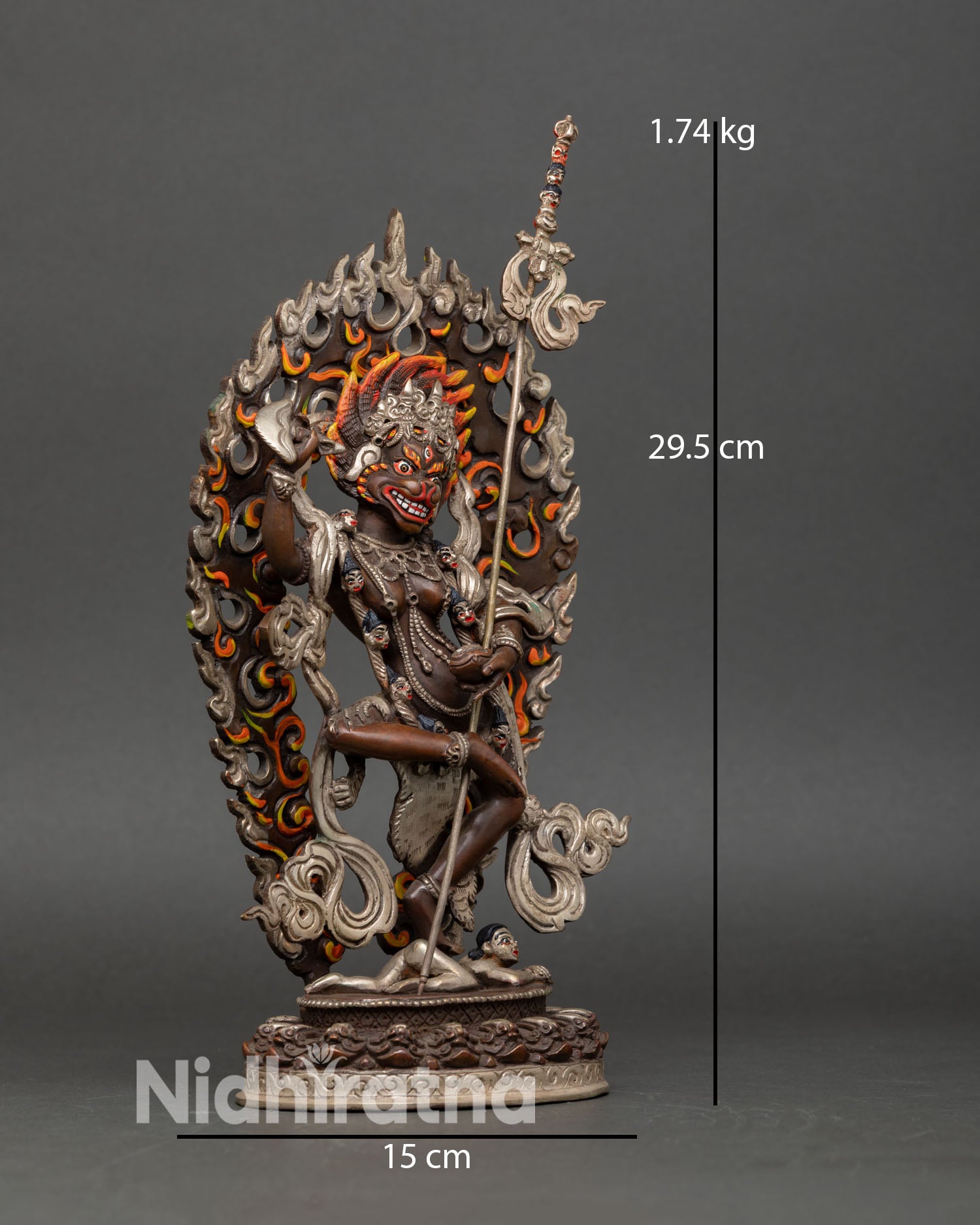 Side view of Lion Faced Dakini statue dynamic guardian posture standing above symbolic human figure