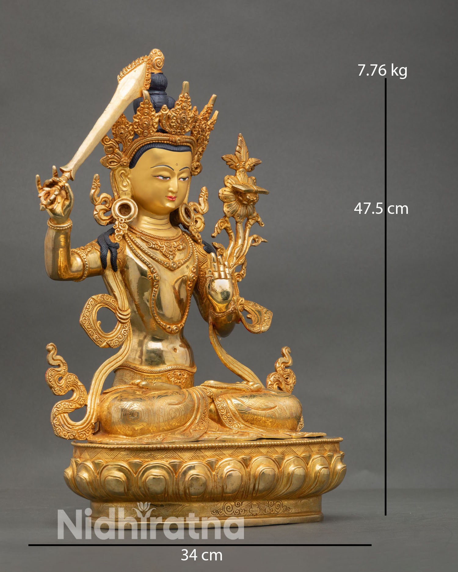 Side view of Manjushree seated on lotus throne holding flaming wisdom sword and Prajnaparamita scripture