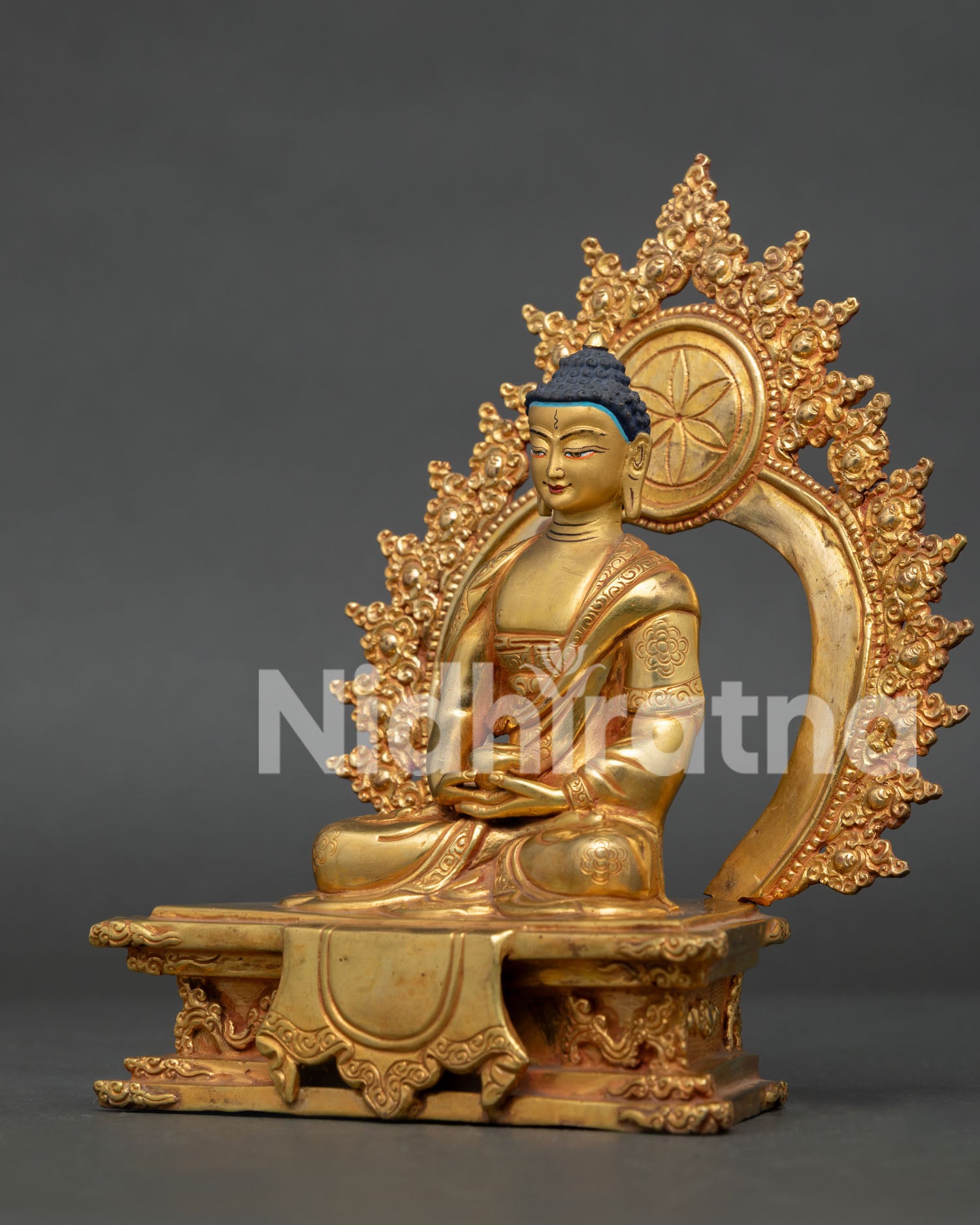 Side view of Amitabha Buddha seated on royal throne with intricate Newari craftsmanship.